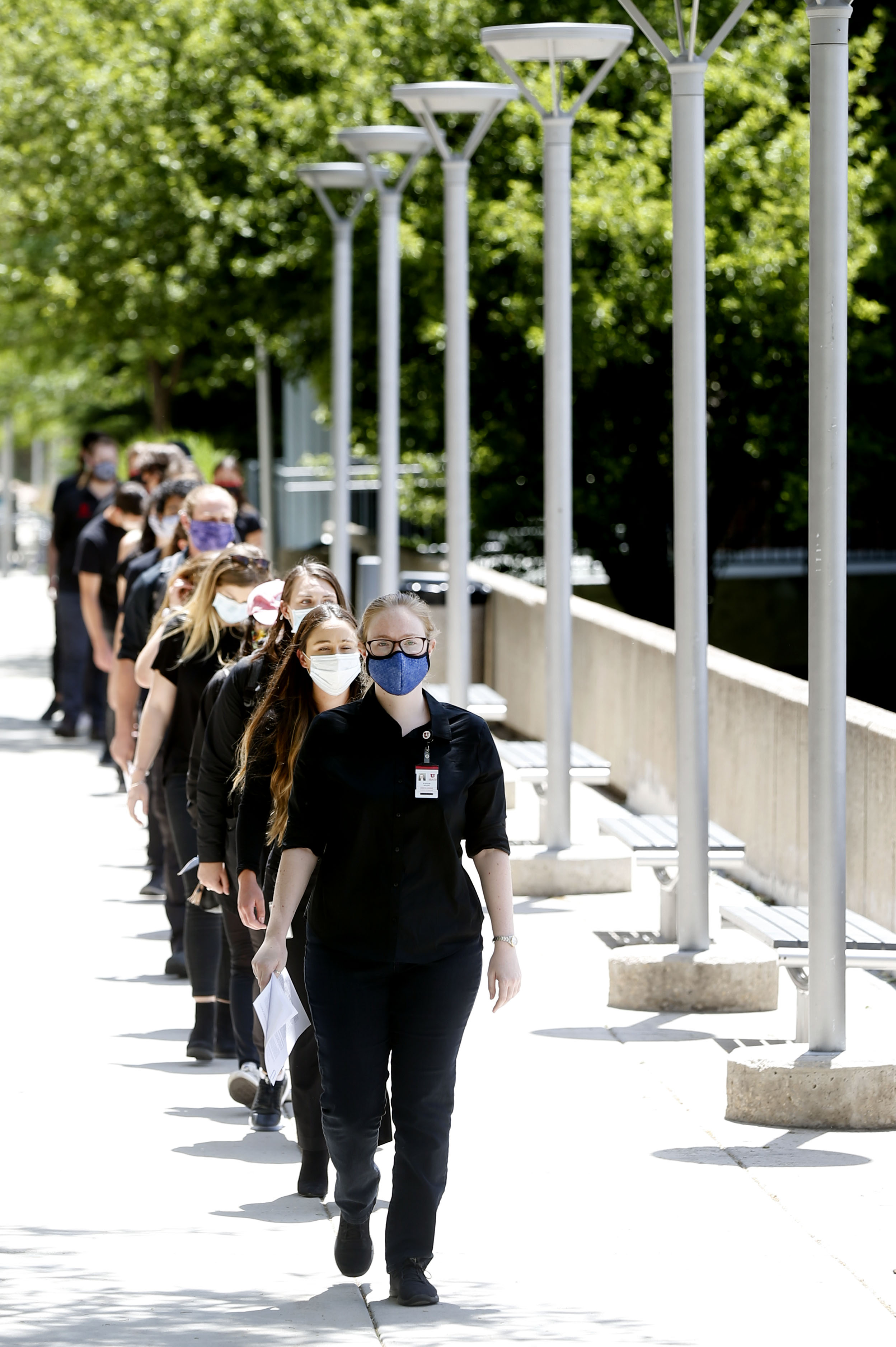 University of Utah School of Medicine students, residents, physician assistants and community members walk in single file to deliver a list of demands to medical school administrators in accordance with the mission of White Coats for Black Lives in Salt Lake City on Friday, June 12, 2020. (Photo: Laura Seitz, KSL)