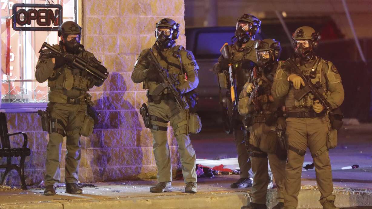 The Latest: Clemson football players lead march on campus