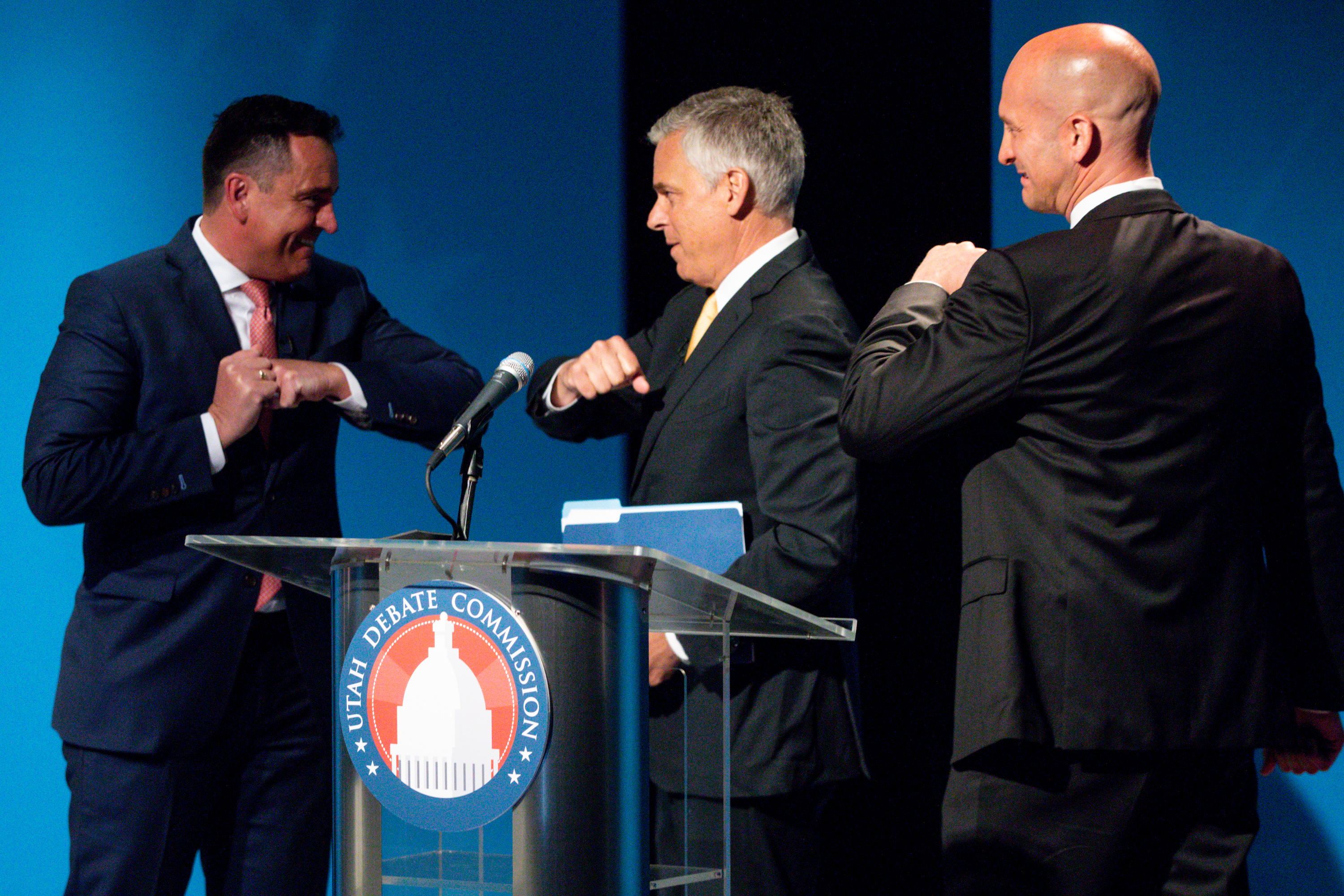 Former Utah House Speaker Greg Hughes, left, bumps elbows with former Gov. Jon Huntsman Jr., center, while former Utah GOP Chairman Thomas Wright goes in for an elbow bump, too, following a Utah gubernatorial Republican primary debate at the PBS Utah studio at the University of Utah in Salt Lake City on Monday, June 1, 2020. (Photo: Ivy Ceballo, KSL)