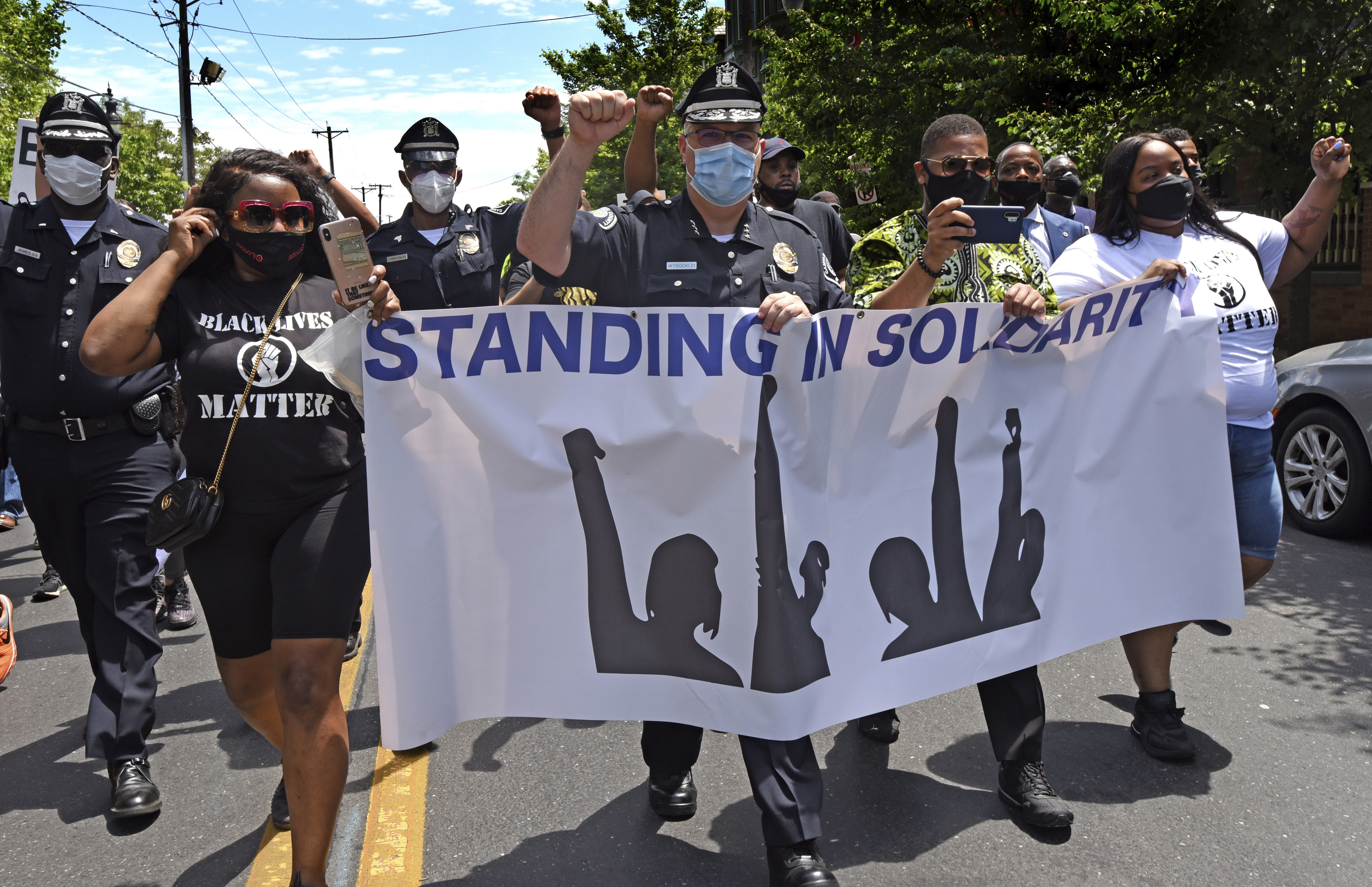 In this Saturday, May 30, 2020, photo, Camden County Metro Police Chief Joe Wysocki raises a fist while marching with Camden residents and activists in Camden, N.J., to protest the death of George Floyd in Minneapolis. Police officers in one of New Jersey's largest and most violent cities were praised on social media for marching alongside protesters in rallies held this weekend over Floyd's death. (Photo: April Saul via AP)