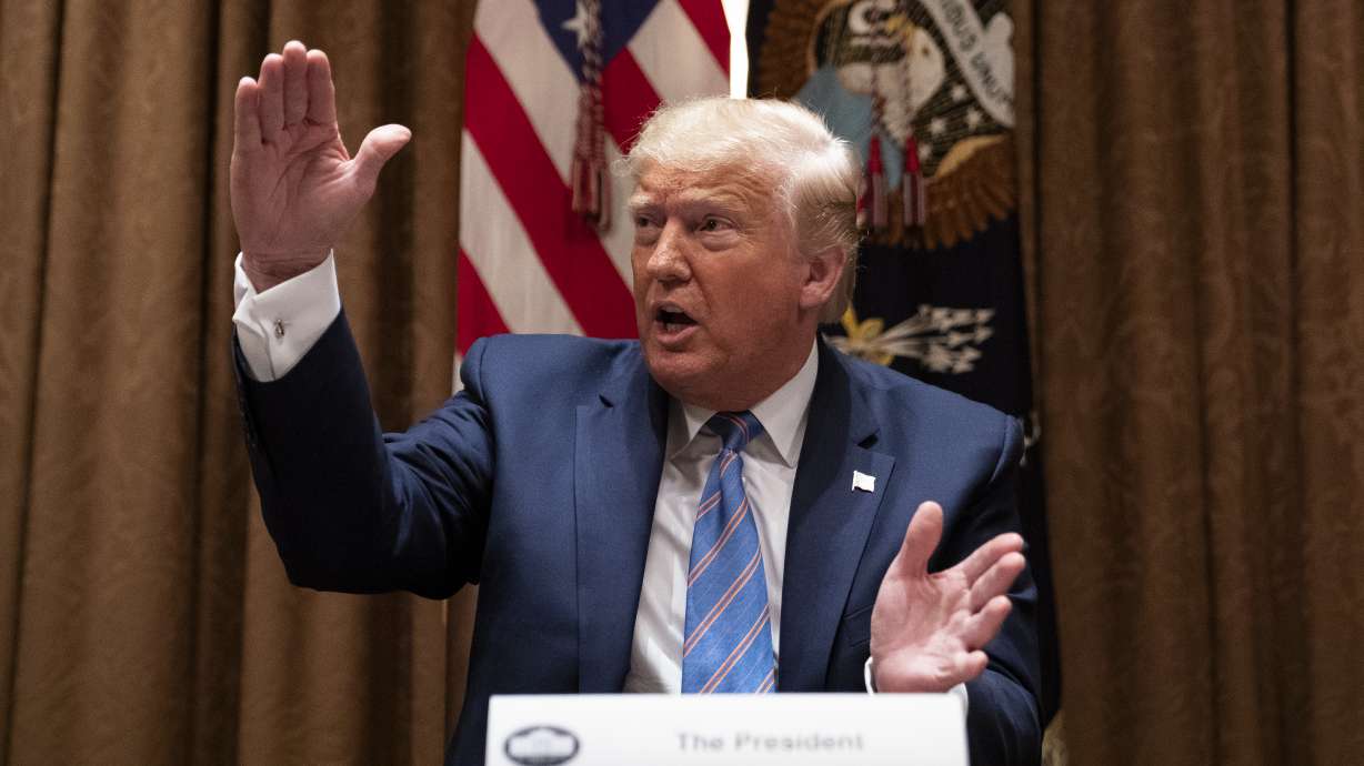 The Latest: Portland reporters injured by police at protests