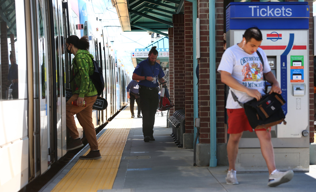 TRAX riders get on and off a train at the Murray Central Station on Wednesday, June 17, 2020. (Photo: Scott G Winterton)