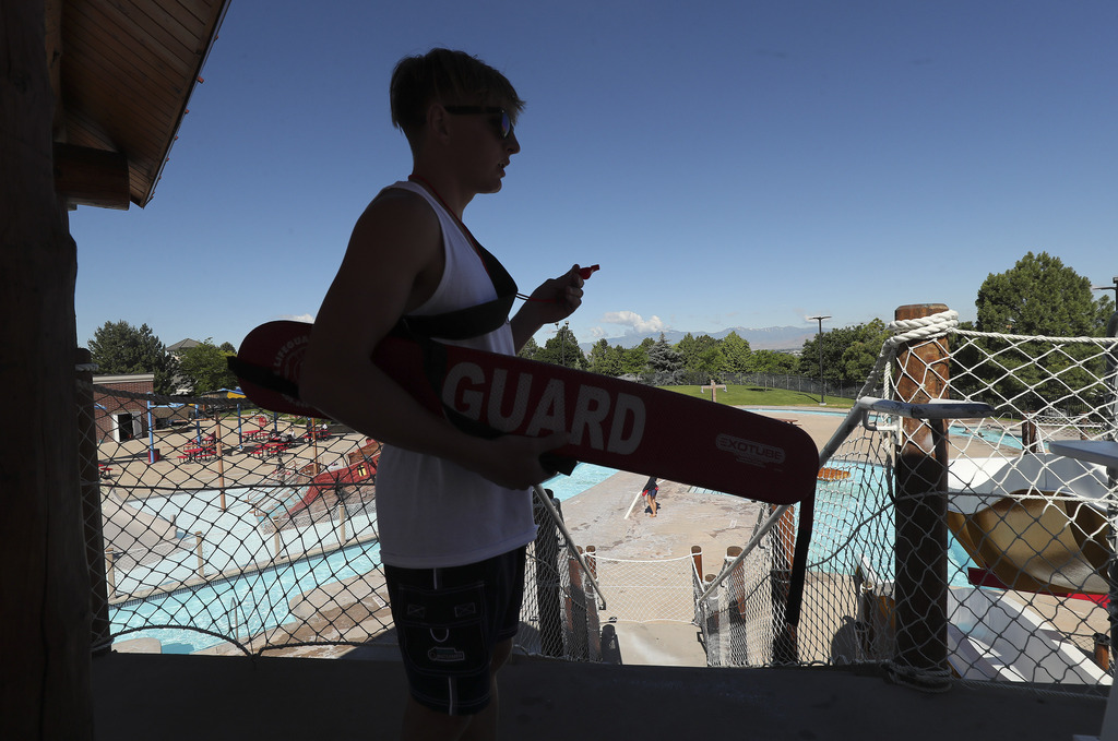 Lifeguard Dexter Gundersen watches swimmers at the Lindon Aquatics Center in Lindon on Tuesday, June 9, 2020. Gundersen was able to find a summer job despite the impacts of the COVID-19 pandemic. (Photo: Jeffrey D Allred, KSL)