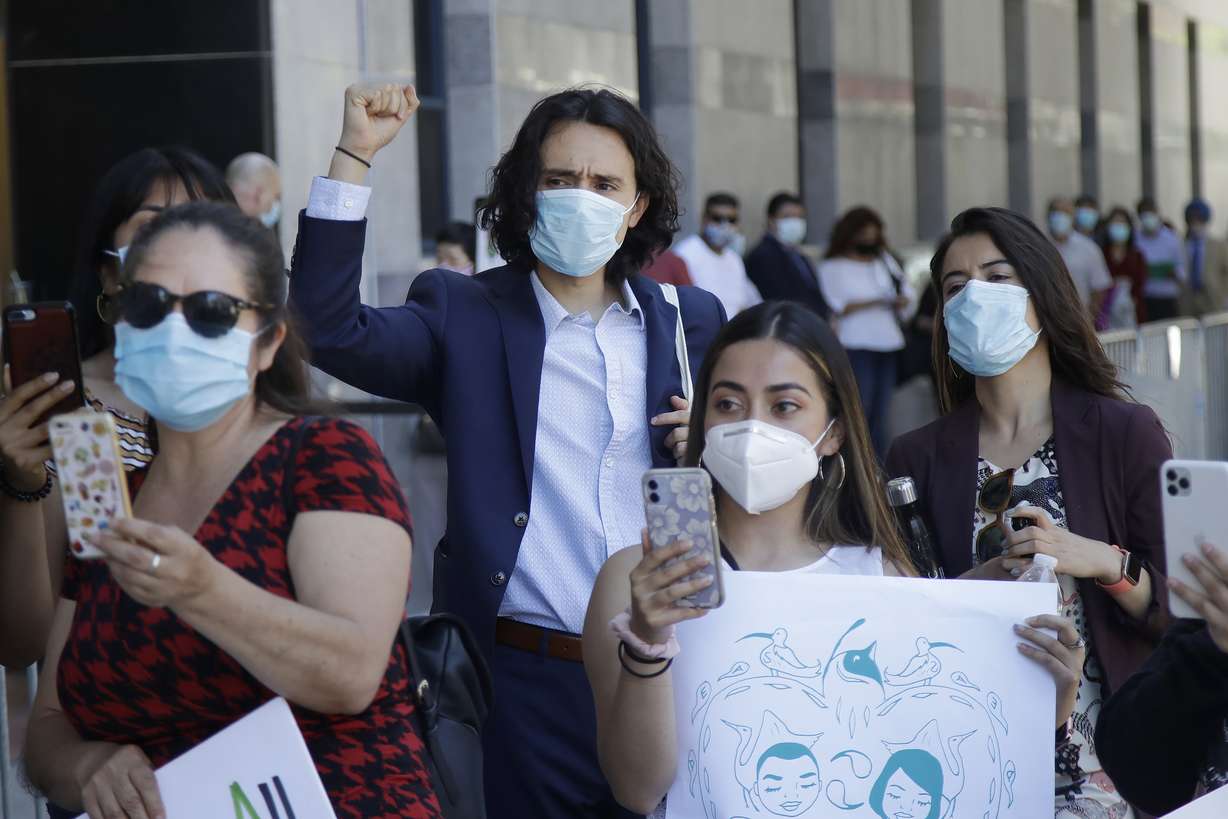 Luis Angel Reyes Savalza, center, raises his fist as he listens to speakers at a rally of immigrant youths and supporters in San Francisco, Thursday, June 18, 2020. (Photo: Jeff Chiu, AP Photo)