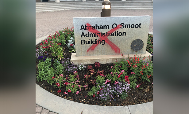 The granite sign outside the Abraham O. Smoot Administration Building is marked with a red "X" following an overnight case of vandalism, Monday, April 14, 2020 on the campus of Brigham Young University in Provo. (Photo: BYU Police via GRAMA Request)