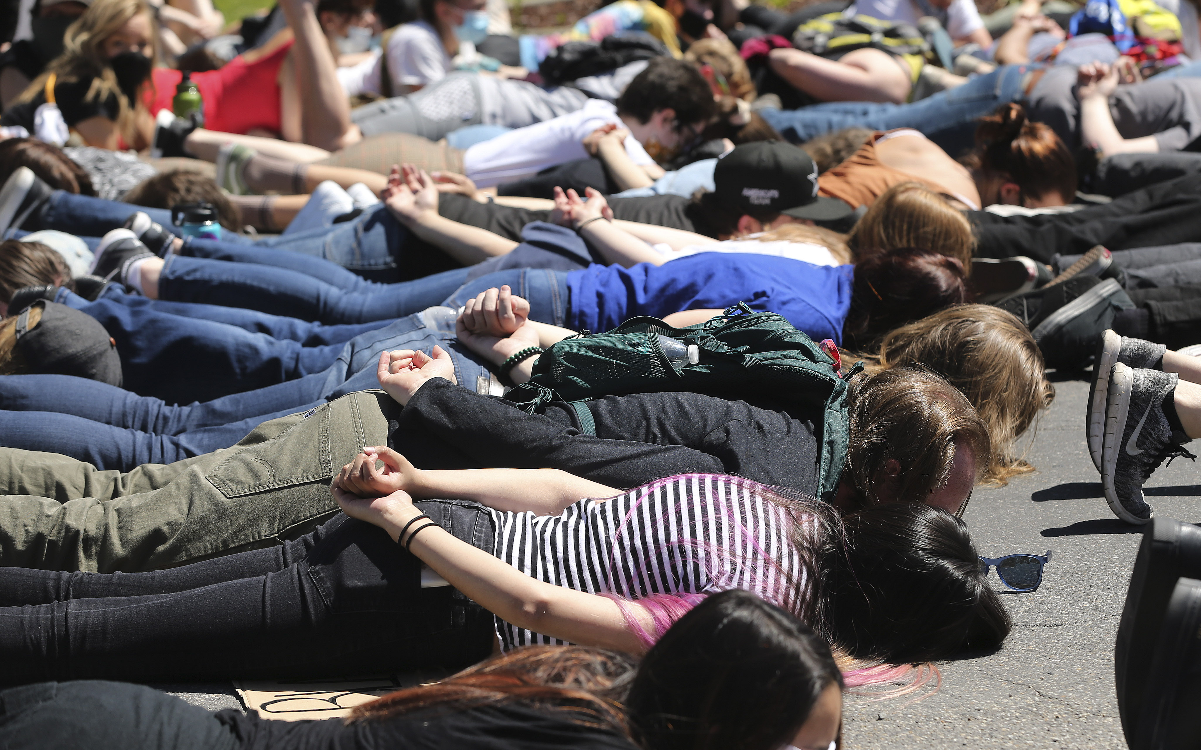 Demonstrators lie in the street as during a Solidarity for Justice protest near Salt Lake City Public Safety Building on Friday, June 19, 2020. (Jeffrey D. Allred, KSL)