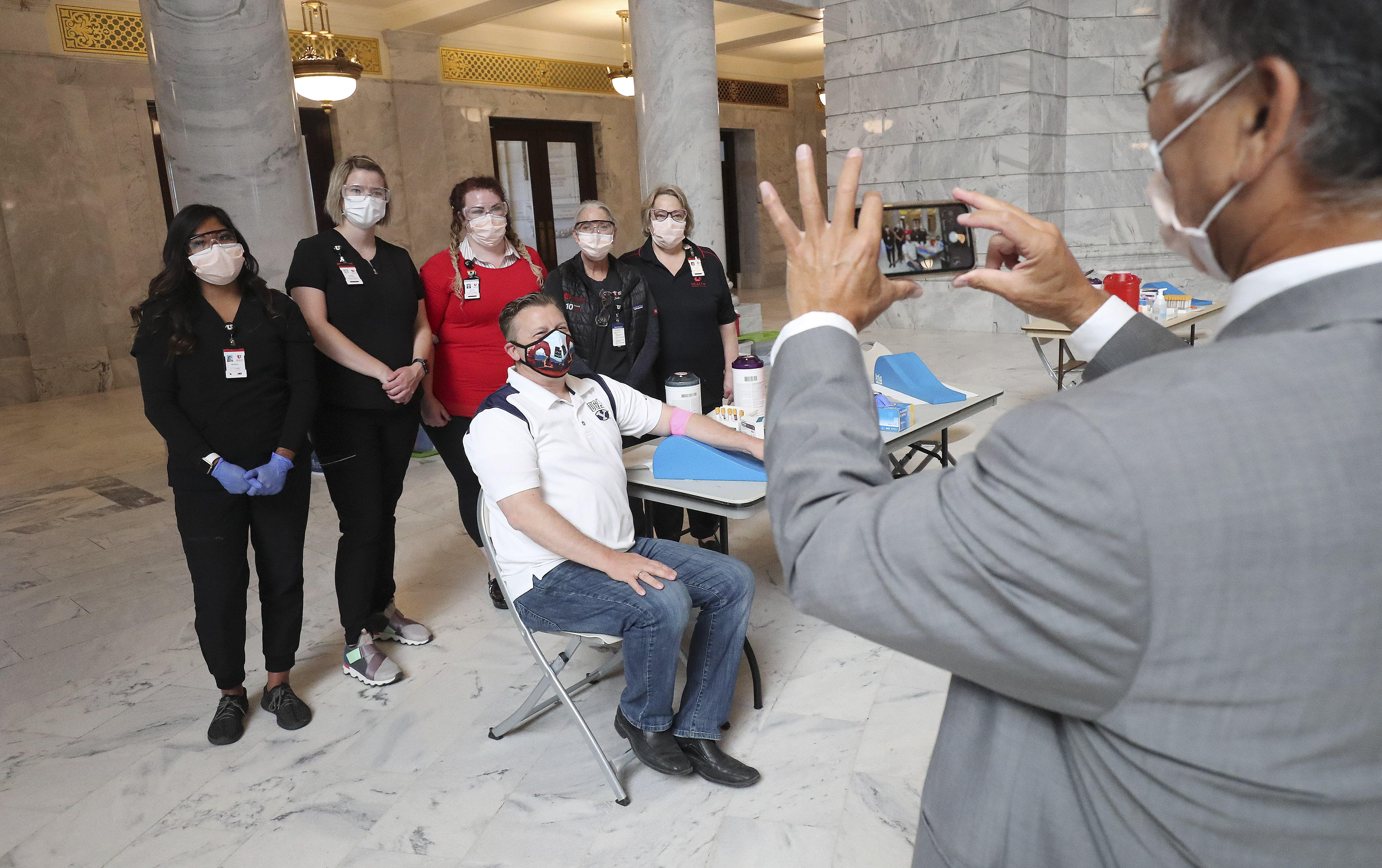Sen. Todd Weiler, R-Woods Cross, has a photo taken with phlebotomists after after giving blood for a serology test for COVID-19 the Capitol in Salt Lake City on Friday, June 19, 2020. (Photo: Jeffrey D. Allred, KSL)