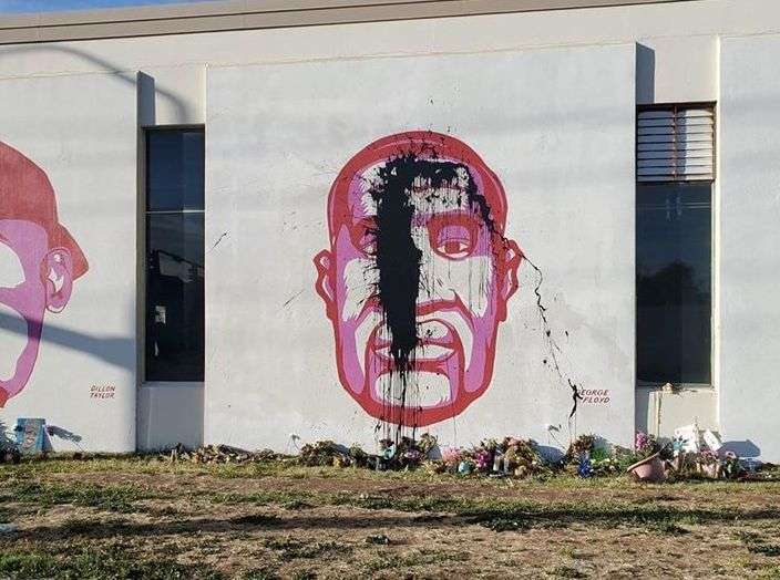 A mural in memorial of George Floyd is splashed with what local photographer Chris Kensington believes to be tar, discovered Sunday, June 21, 2020 in downtown Salt Lake City. (Courtesy photo: Chris Kensington)