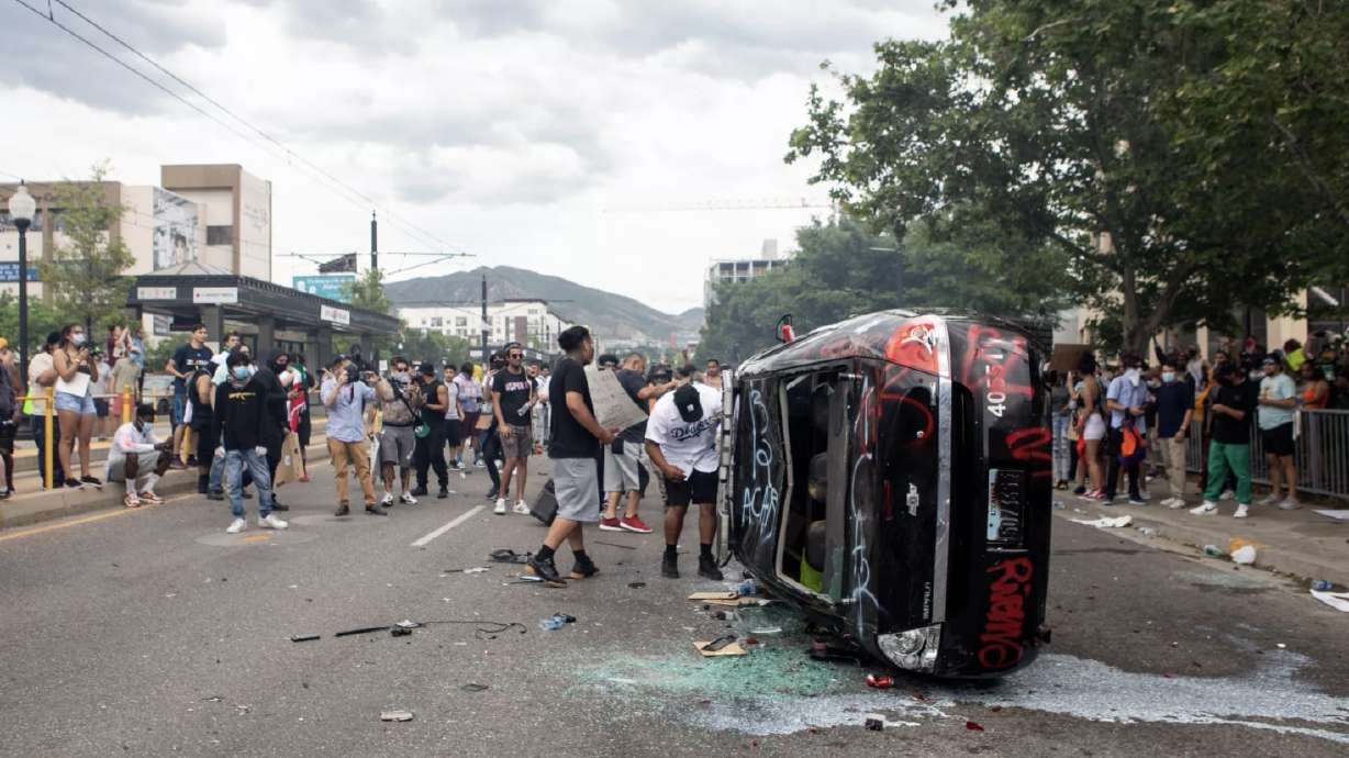 8th and 9th people charged with vandalizing police car during downtown riot