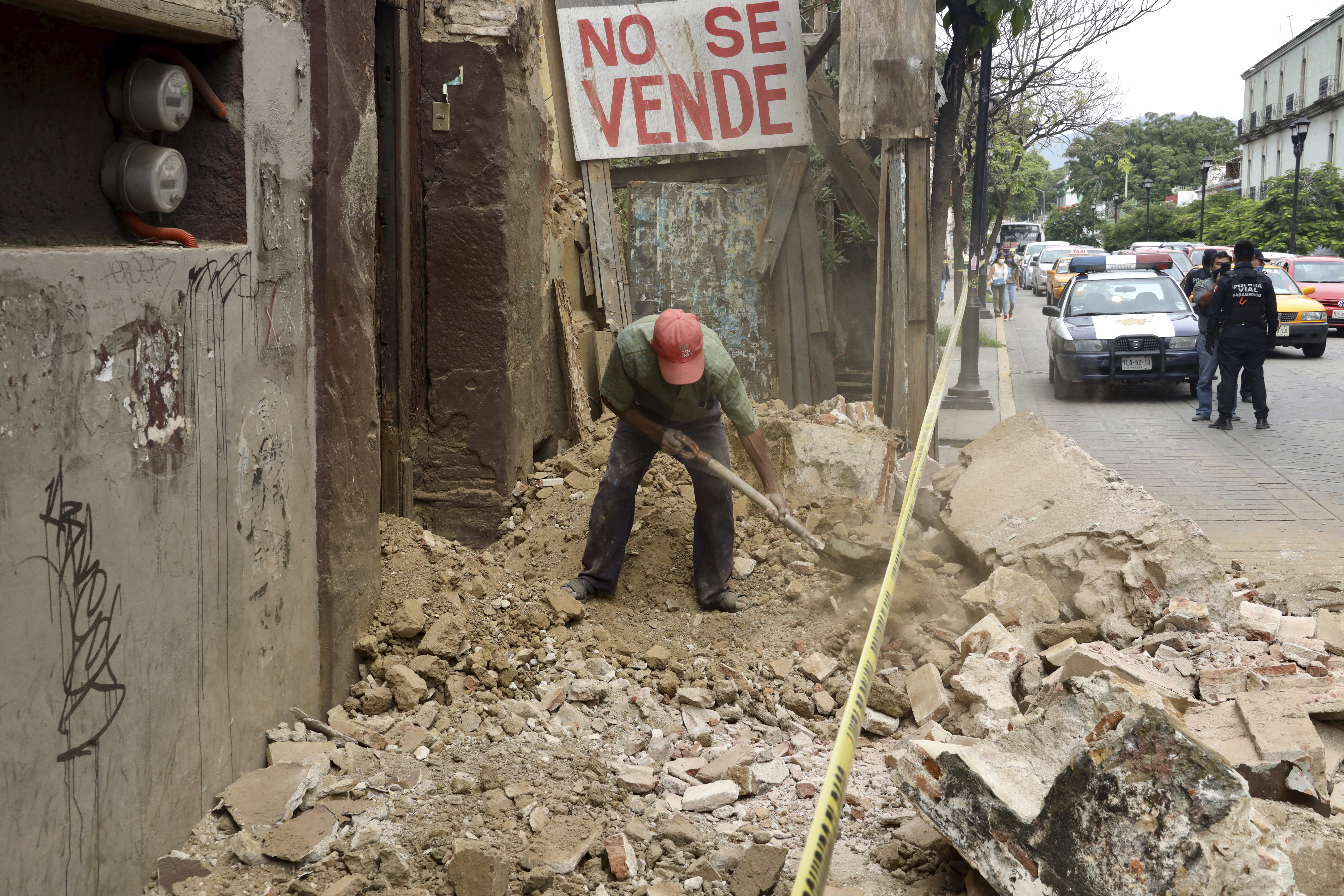 A man removes rubble from a building damaged by an earthquake in Oaxaca, Mexico, Tuesday, June 23, 2020. (Luis Alberto Cruz Hernandez, AP Photo)