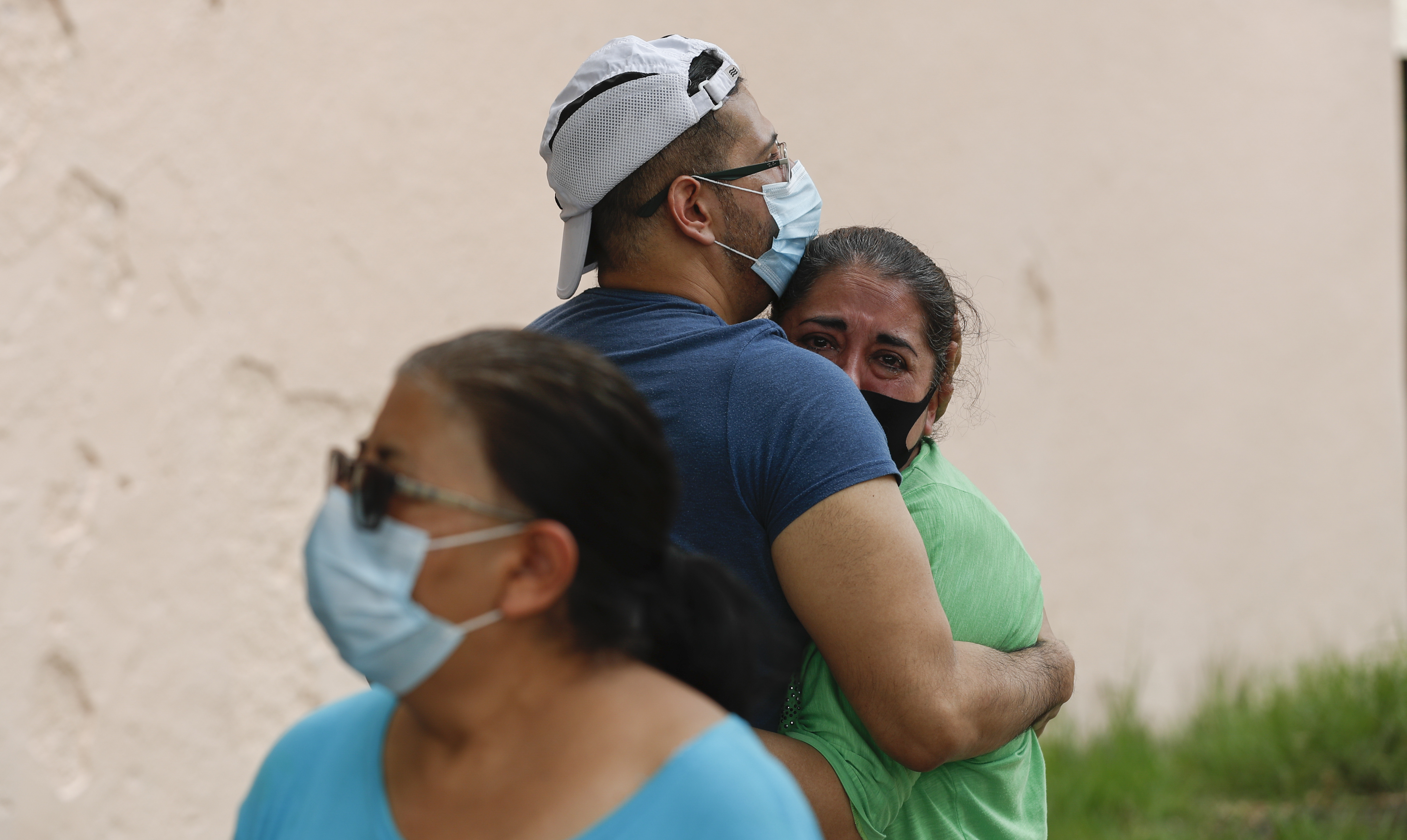 People embrace on the street as they wait for the all-clear to return to their apartment after an earthquake in Mexico City, Tuesday, June 23, 2020. The earthquake struck near the Huatulco resort in the Oaxaca state on Tuesday morning, swayed buildings in Mexico City and sent thousands fleeing into the streets. (Eduardo Verdugo, AP Photo)