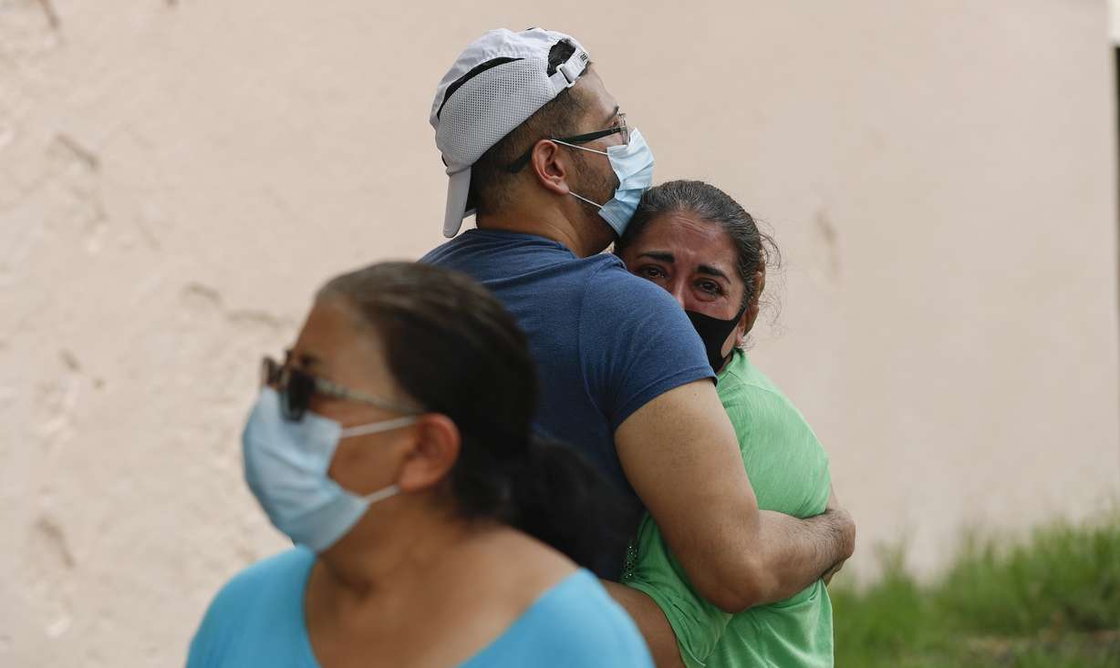 People embrace on the street as they wait for the all-clear to return to their apartment after an earthquake in Mexico City, Tuesday, June 23, 2020. The earthquake struck near the Huatulco resort in the Oaxaca state on Tuesday morning, swayed buildings in Mexico City and sent thousands fleeing into the streets. (Eduardo Verdugo, AP Photo)