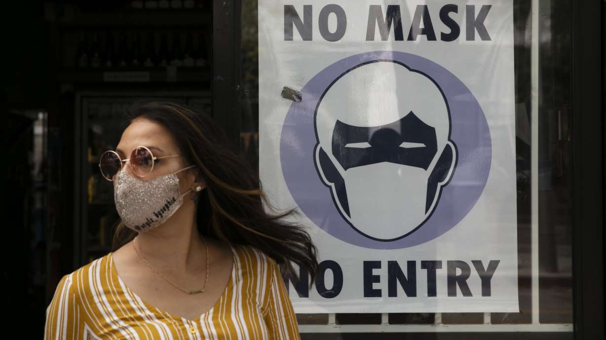 The Latest: Hawaii to let some visitors avoid quarantine
