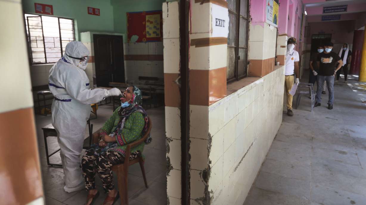 The Latest: Mayo Clinic to end pay cuts, recall workers