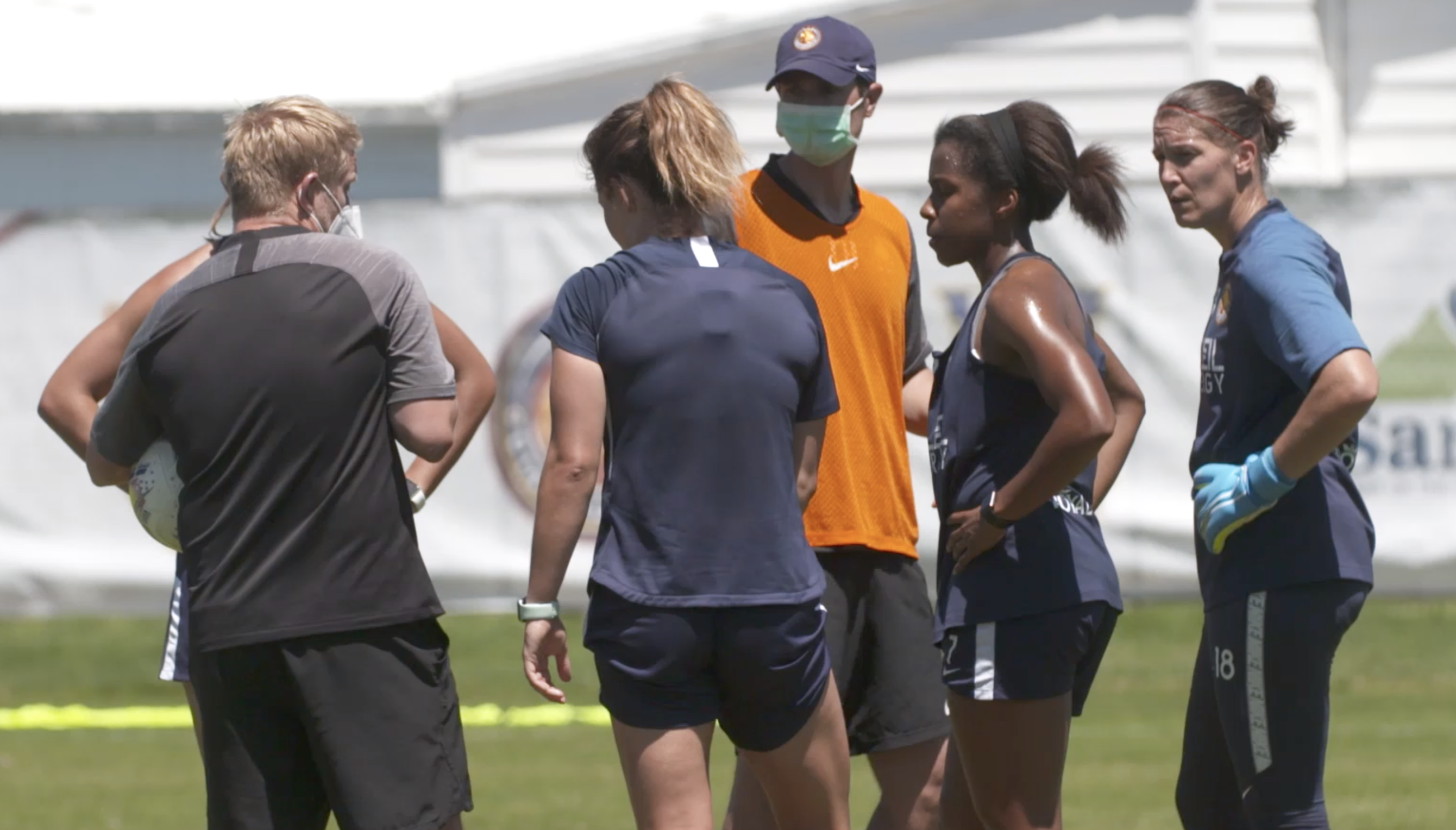 Utah Royals FC coach Craig Harrington wears a mask while guiding his team, including defender Elizabeth Ball and goalkeeper Nicole Barnhart, through a recent training session before the NWSL Challenge Cup. (Courtesy photo: Utah Royals FC)