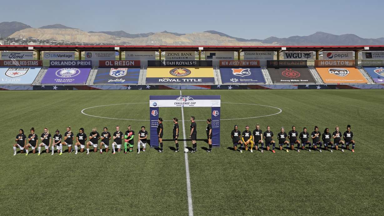 Players for the Portland Thorns, left, and the North Carolina Courage kneel during the national anthem before the start of their NWSL Challenge Cup soccer match at Zions Bank Stadium Saturday, June 27, 2020, in Herriman, Utah. (Photo: Rick Bowmer, AP)