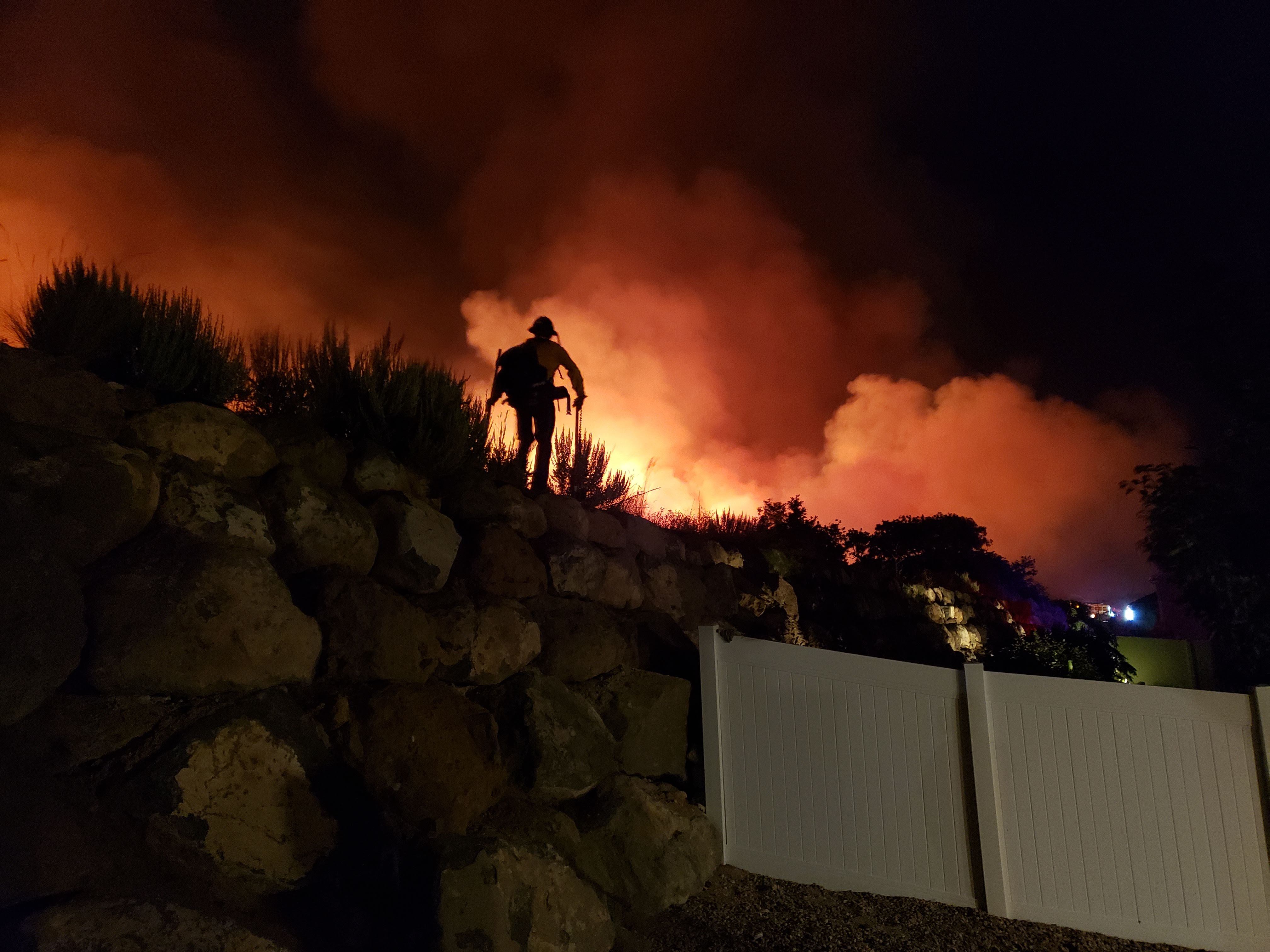 Fire crews respond to residential neighborhoods to fight back the Traverse Mountain in Lehi and Alpine, which swelled as large as 1,000 acres. (Courtesy photo: Ryan Miner)