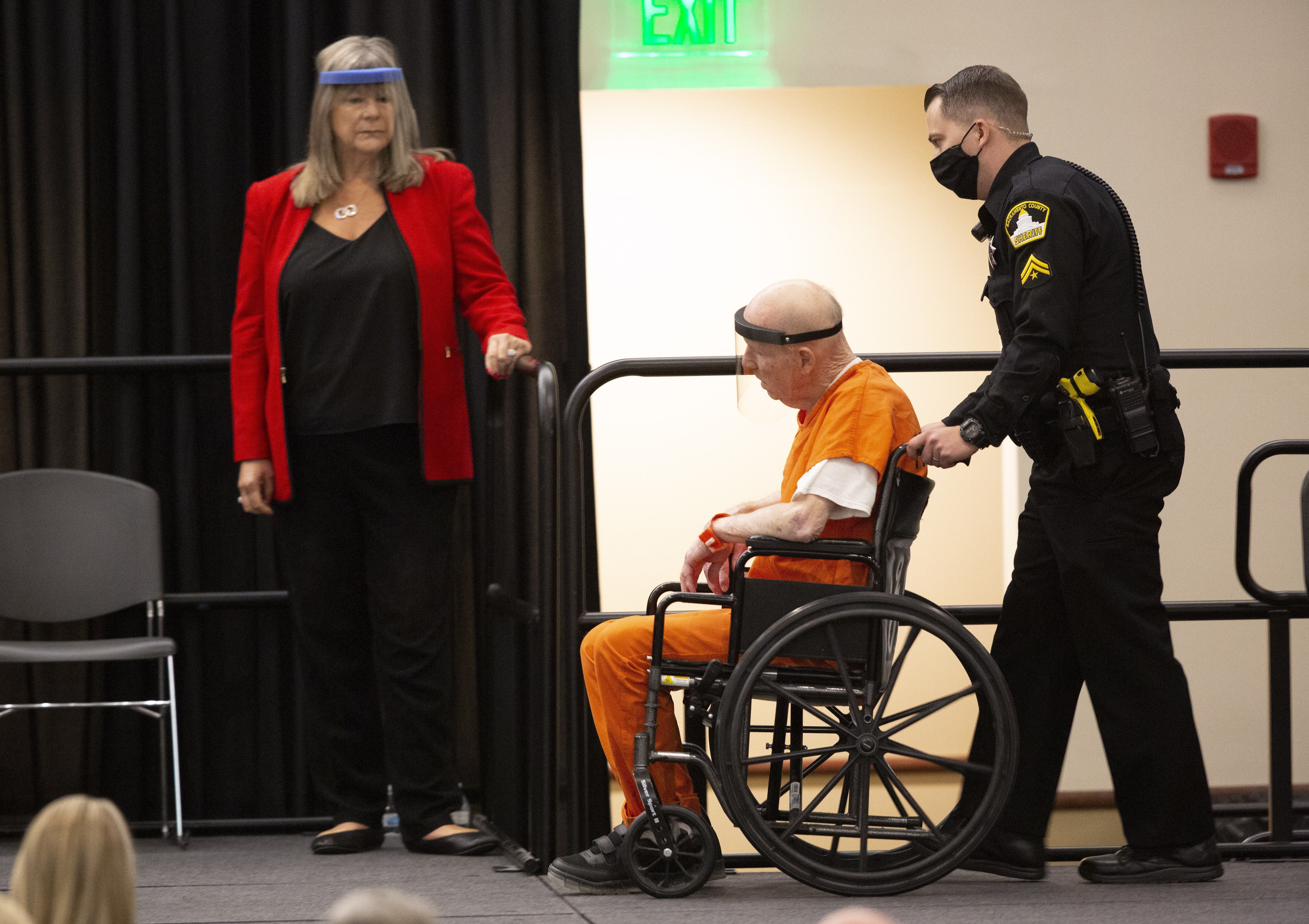 Joseph James DeAngelo, charged with being the Golden State Killer, is wheeled into the courtroom as his attorney, public defender Diane Howard, left, looks on in Sacramento, Calif., Monday June 29, 2020. (Rich Pedroncelli, AP Photo)