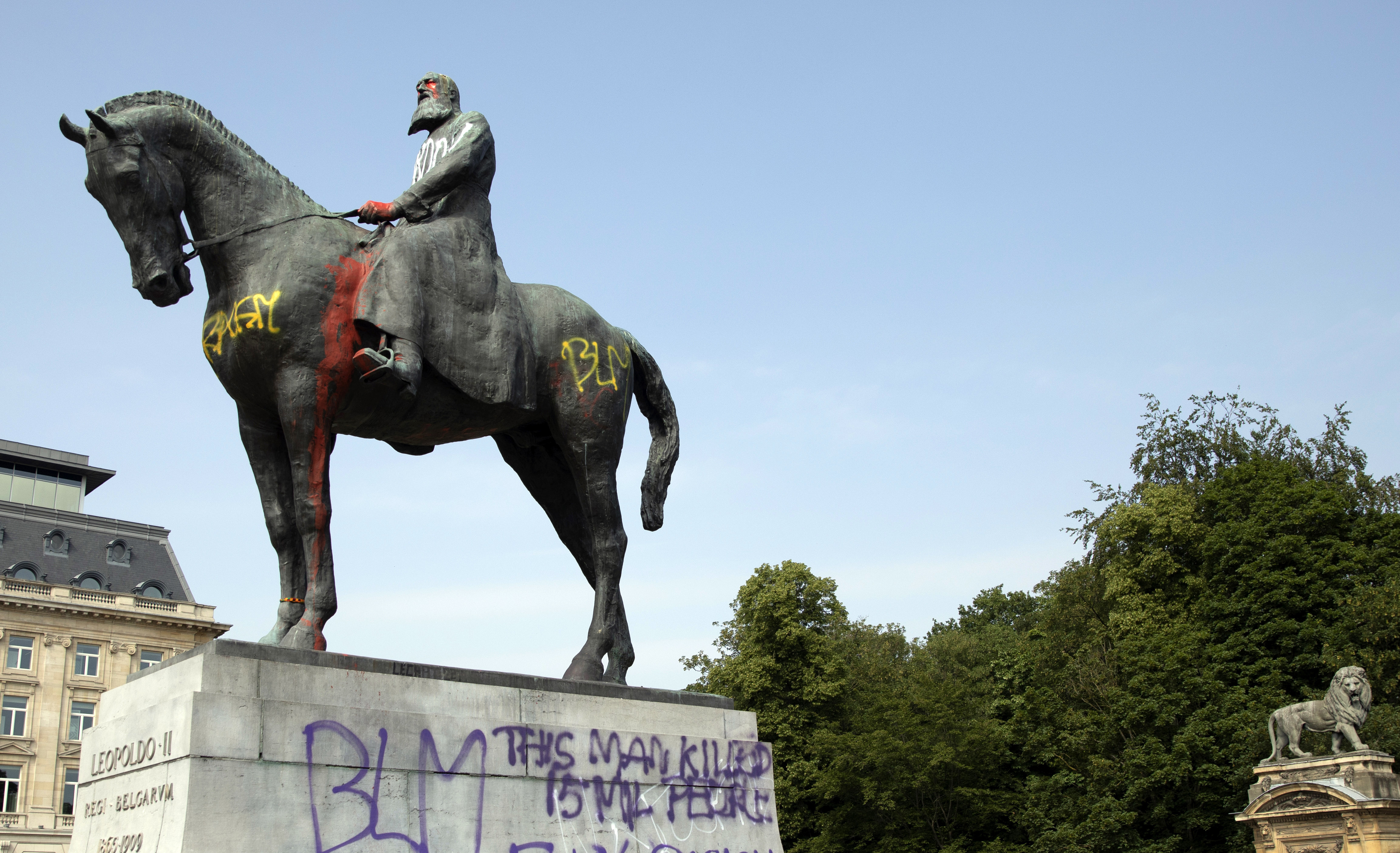 Belgium takes down statue, king regrets colonial violence