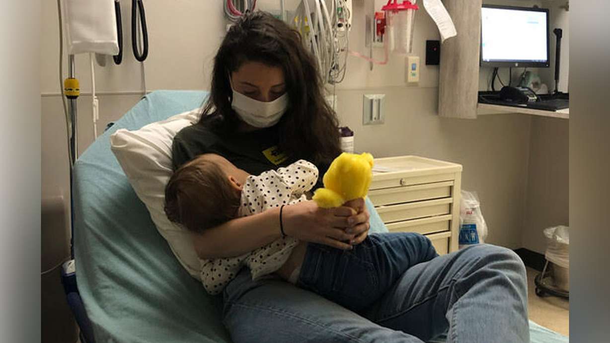 Kirsten Smith holds her daughter, Zoe, who is undergoing treatment for chronic myeloid leukemia at Primary Children’s Hospital in Salt Lake City. The 14-month-old's parents are pleading with people from all over the world to get on the bone marrow registry in hopes that doing so might save her life. (Photo: Kirsten Smith)