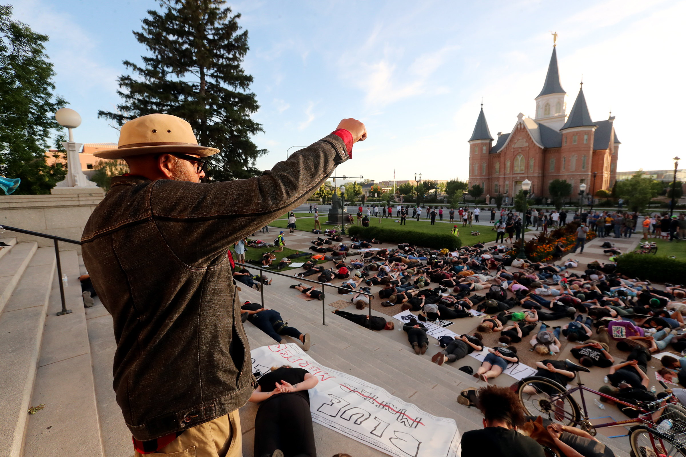 Macky, who did not provide a last name, holds his fist high for 8 minutes and 46 seconds as protesters lay down as they gather in Provo on Wednesday, July 1, 2020. (Scott G. Winterton, KSL)