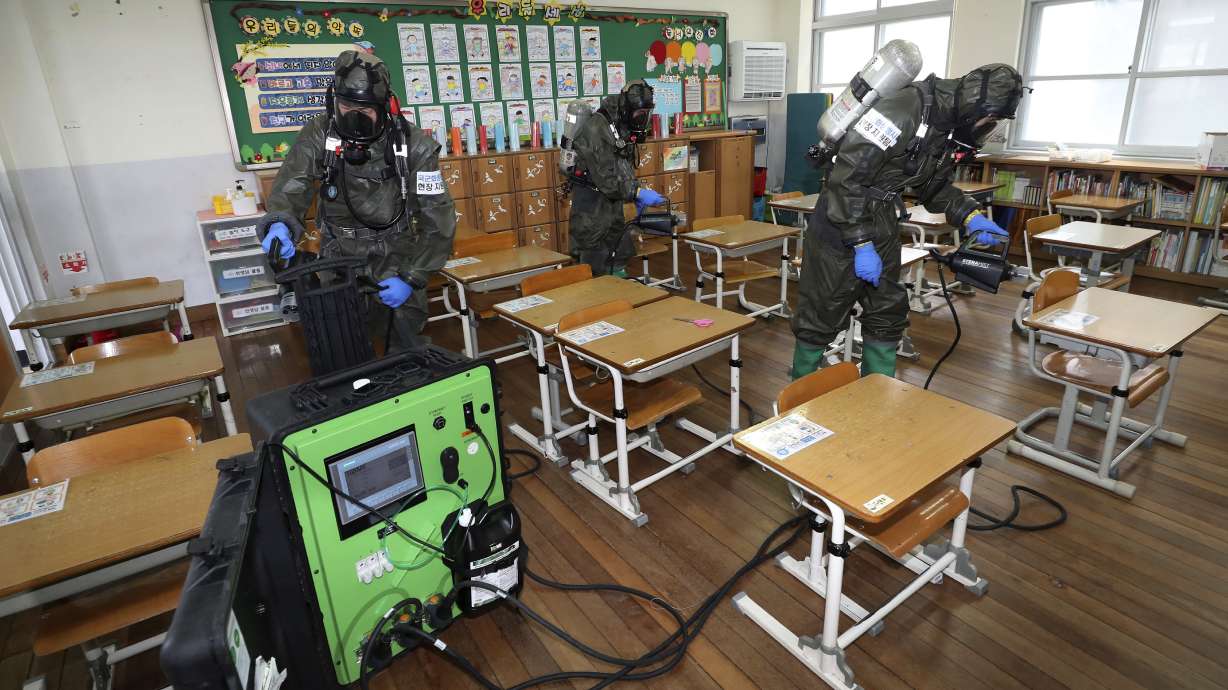 The Latest: South Korea has 63 newly confirmed virus cases