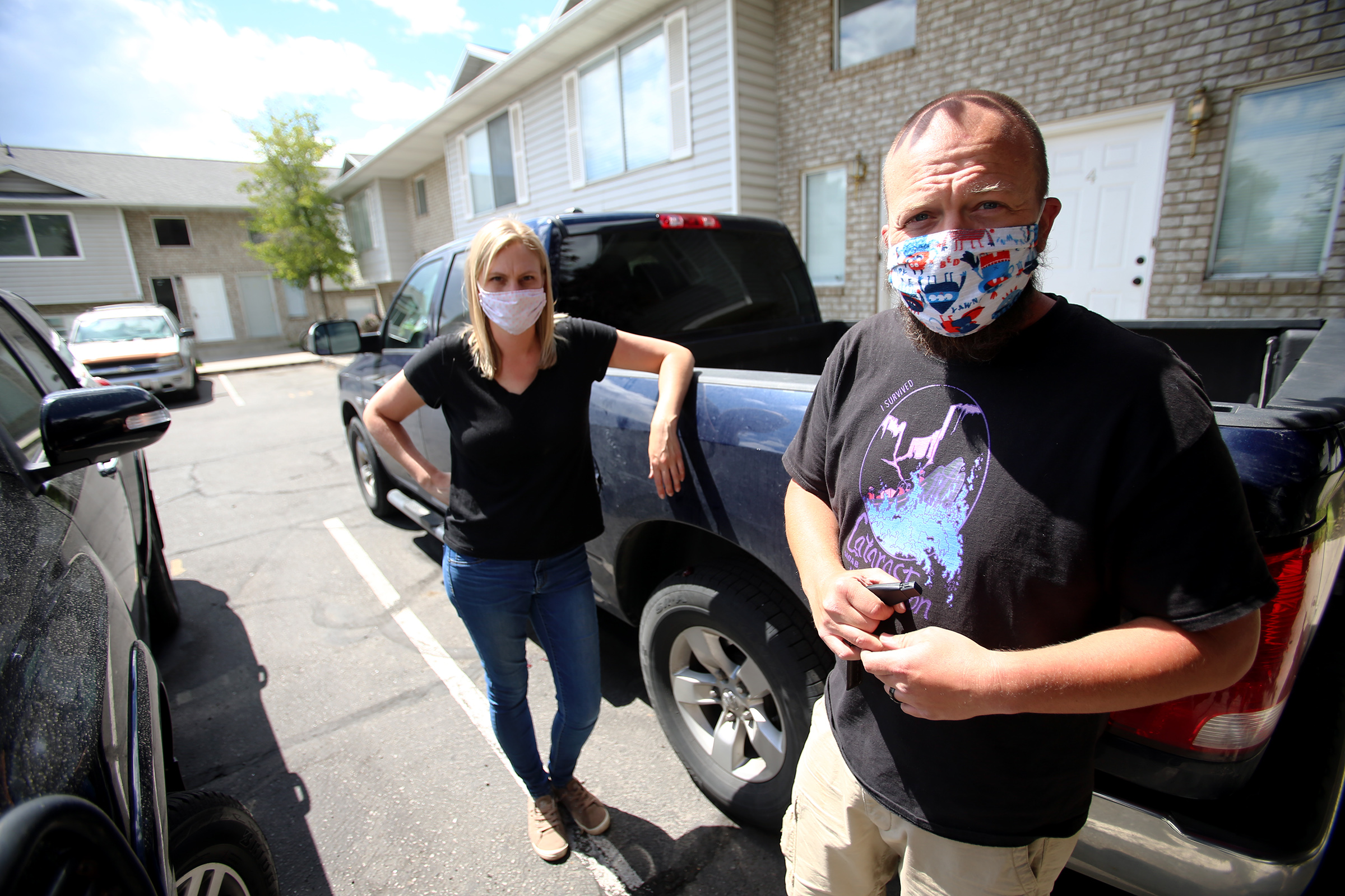 Courtney and Matthew Tiemann pose for a photo after unloading a truck of belongings into their condo in Provo on Tuesday, June 30, 2020. The couple planned to go on a cruise and then COVID-19 happened and their plans changed. (Photo: Scott G Winterton, KSL)