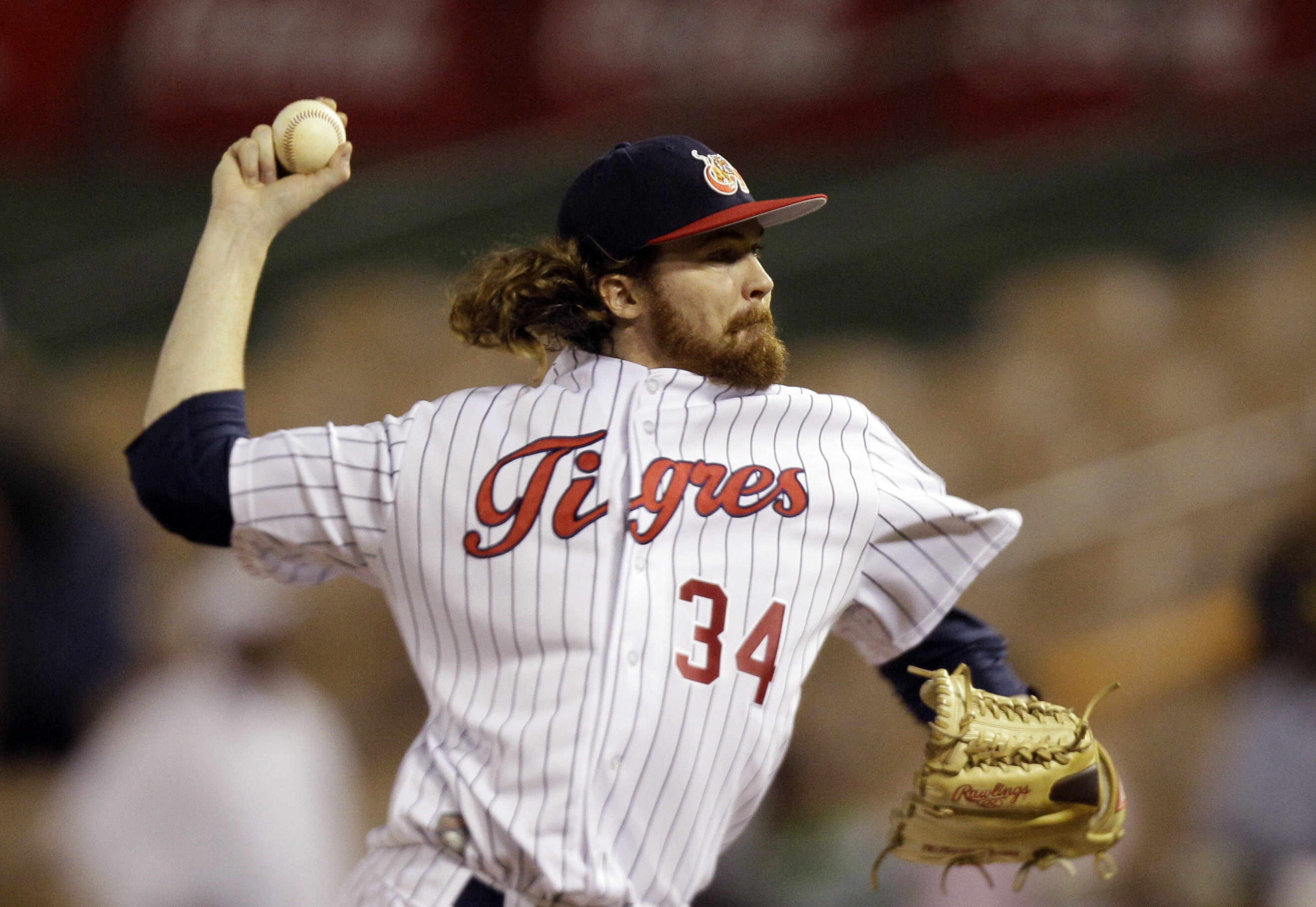 In this Feb. 3, 2012, file photo, Venezuela's starting pitcher Tyson Brummett throws in the first inning against against Dominican Republic at a Caribbean Series baseball game at Quisqueya stadium in Santo Domingo, Dominican Republic. Former Philadelphia Phillies pitcher Brummett and three others died in a plane crash in rural Utah. The Utah County Sheriff’s Office says ex-pitcher 35-year-old Brummett of Salt Lake City was flying the small plane, which crashed near Box Elder Peak in American Fork Canyon just before 8 a.m. Friday, July 3, 2020. (AP Photo/Fernando Llano, File)