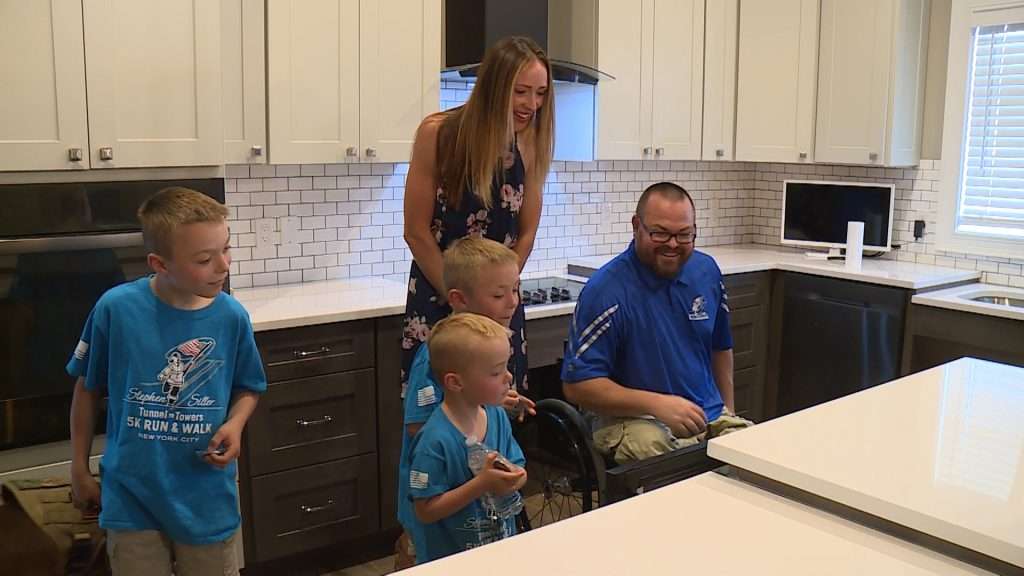 The Vandela family looks at their new kitchen. (KSL TV)
