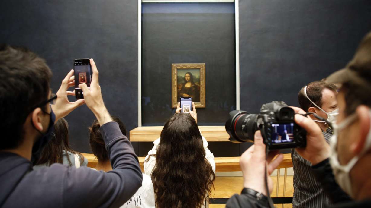 "Mona Lisa" back at work, visitors limited as Louvre reopens