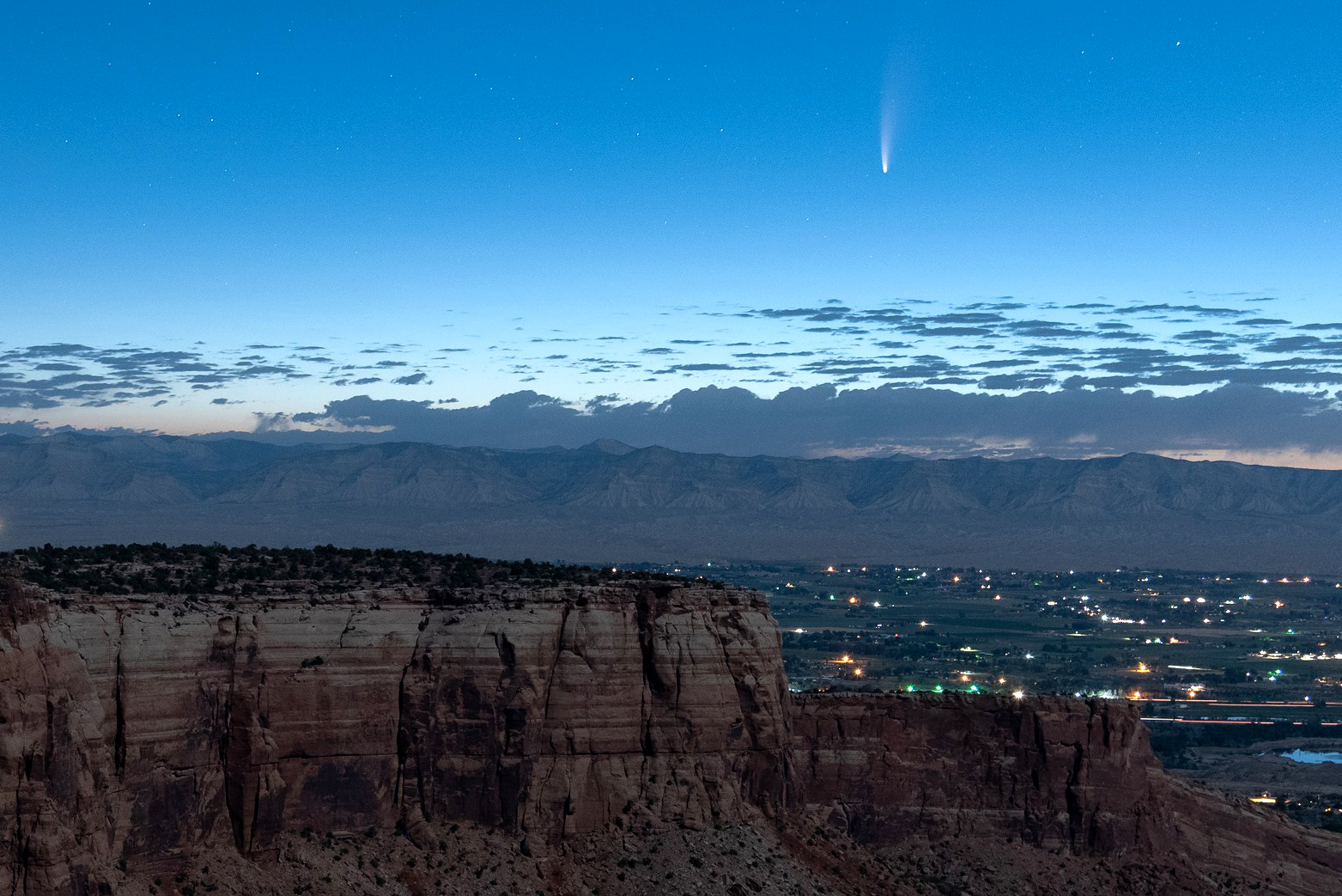 Comet streaking past Earth, providing spectacular show