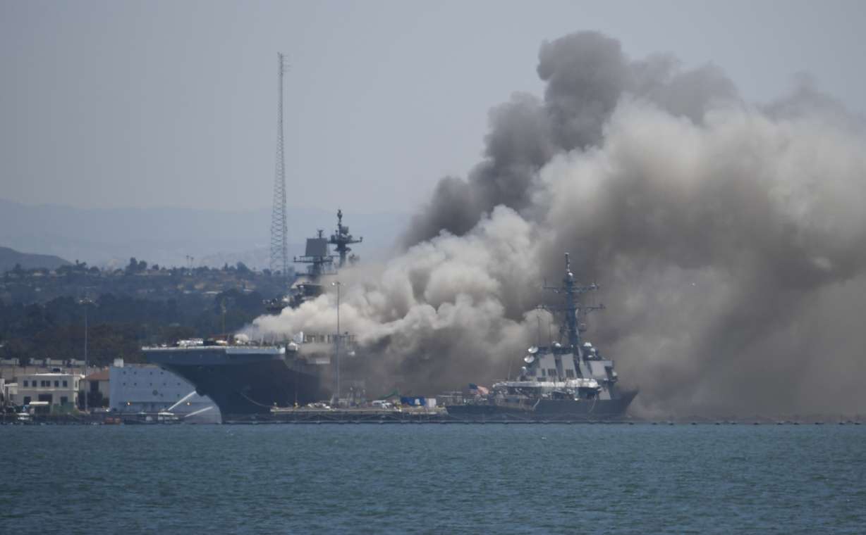 Smoke rises from the USS Bonhomme Richard at Naval Base San Diego Sunday, July 12, 2020, in San Diego after an explosion and fire Sunday on board the ship at Naval Base San Diego. (Denis Poroy, AP Photo)