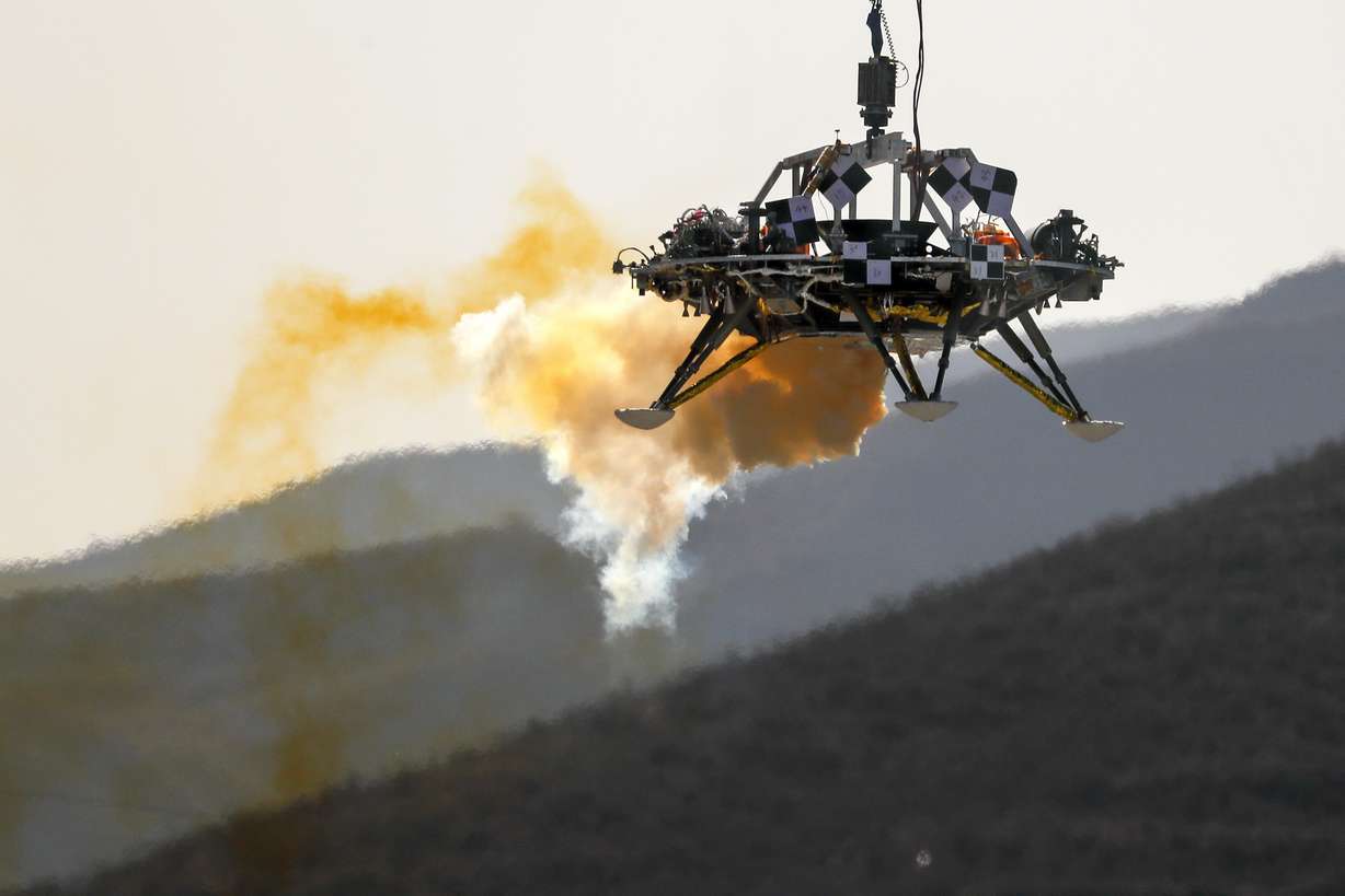 FILE - In this Thursday, Nov. 14, 2019 file photo, the Mars lander's hovering, obstacle avoidance and deceleration capabilities are tested at a facility at Huailai in China's Hebei province. (AP Photo/Andy Wong)