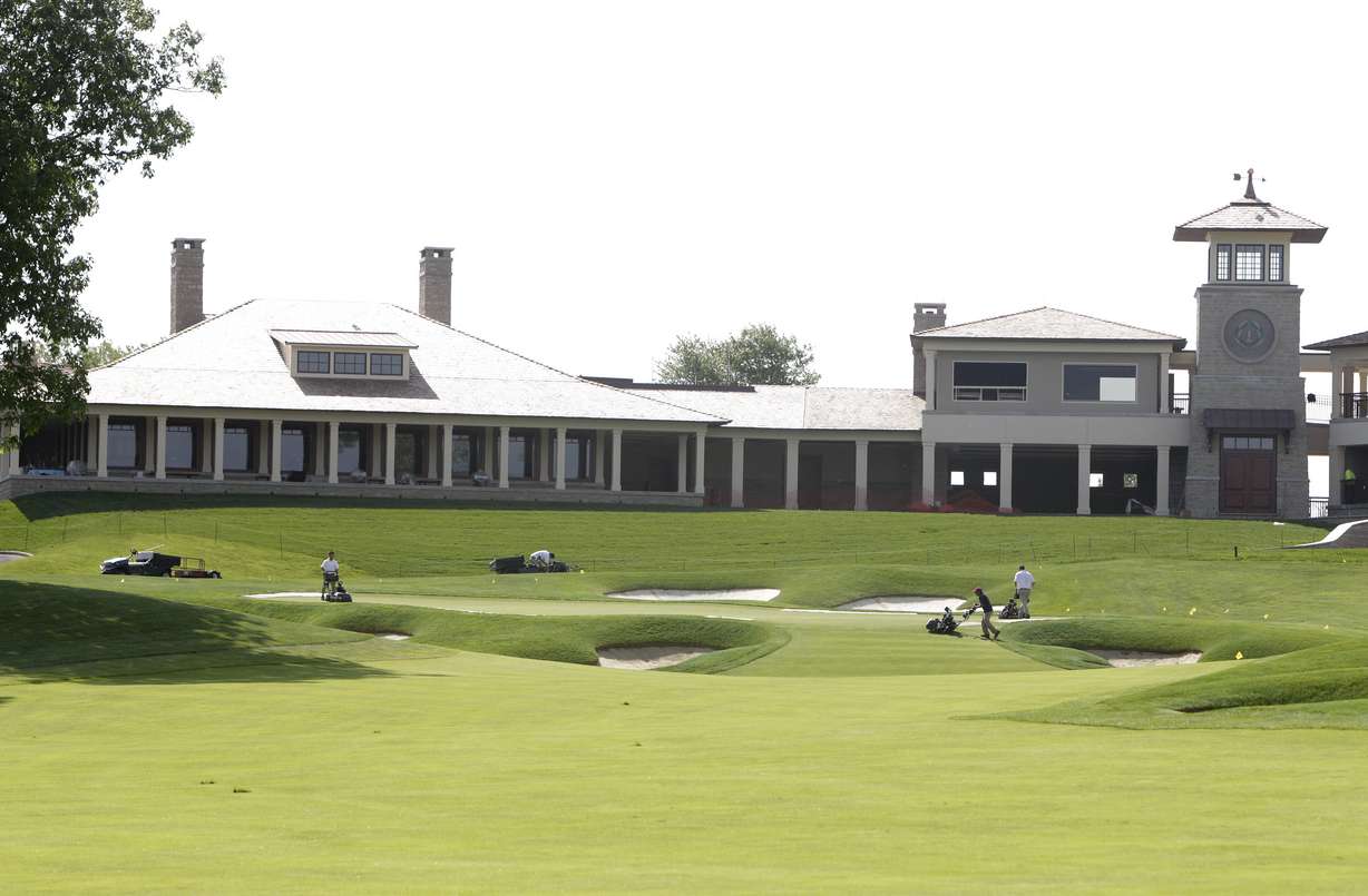 This Wednesday, May 22, 2013, file photo shows the clubhouse and 18th fairway at Muirfield Village Golf Club in Dublin, Ohio. The challenge for the PGA Tour is to make it feel different to the players who will be in Dublin, Ohio, the next two weeks. For the first time in 63 years, two PGA Tour events are being held on the same golf course in consecutive weeks.