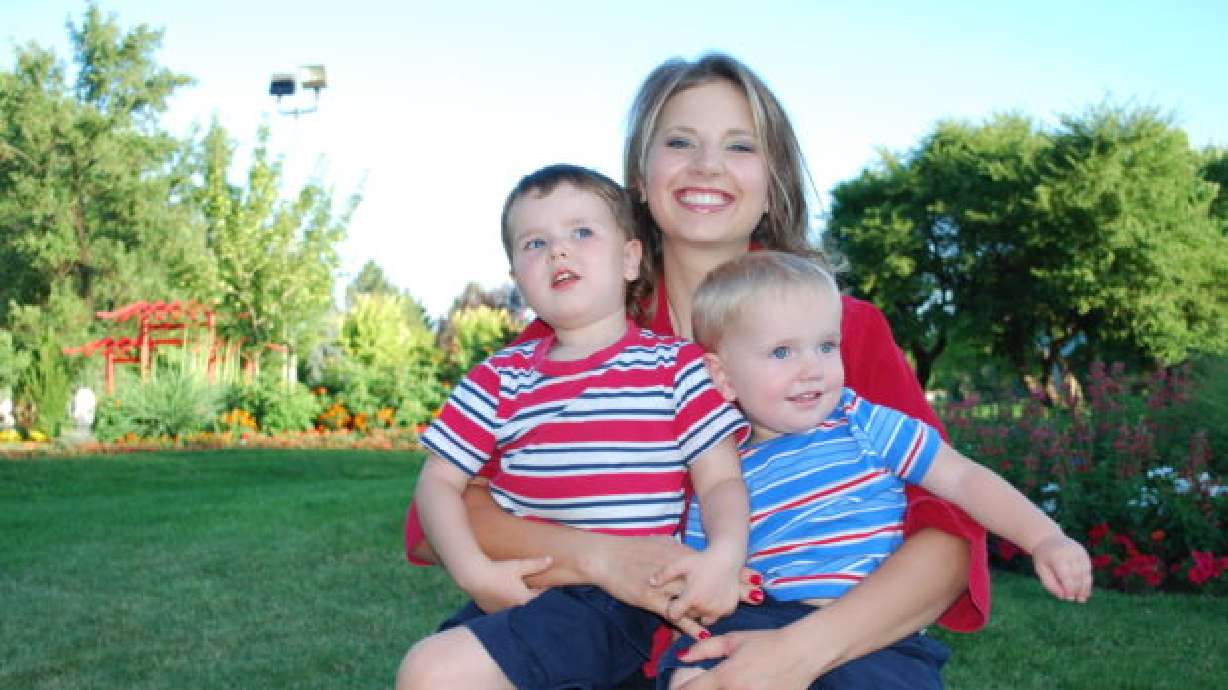 Susan Powell and her sons, Charlie and Braden, pose for a photo on July 24, 2008, at the International Peace Gardens in Salt Lake City, Utah.