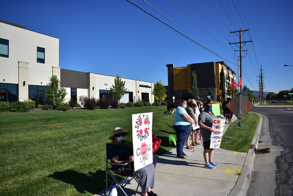 Centerville residents gather outside the offices of CW Land on Monday, July 13, 2020, to protest the proposed sale of Centerville Mobile Estates, a small mobile home community that CW Land intends to turn into modern town homes.