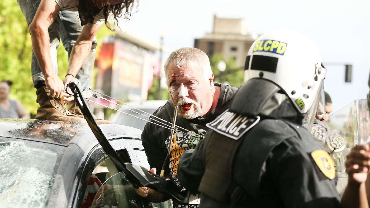 Brandon Earl McCormick exits his car with a bow and arrow after being swarmed by protesters near Library Square in Salt Lake City on Saturday, May 30, 2020. Protesters joined others across the nation to decry the death of George Floyd, a black man, who died while being taken into custody by police in Minneapolis in May. (Photo: Laura Seitz, KSL, File)