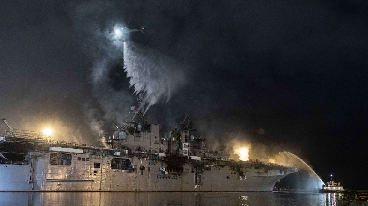Navy warship burning 4th day shows difficulty of ship fires