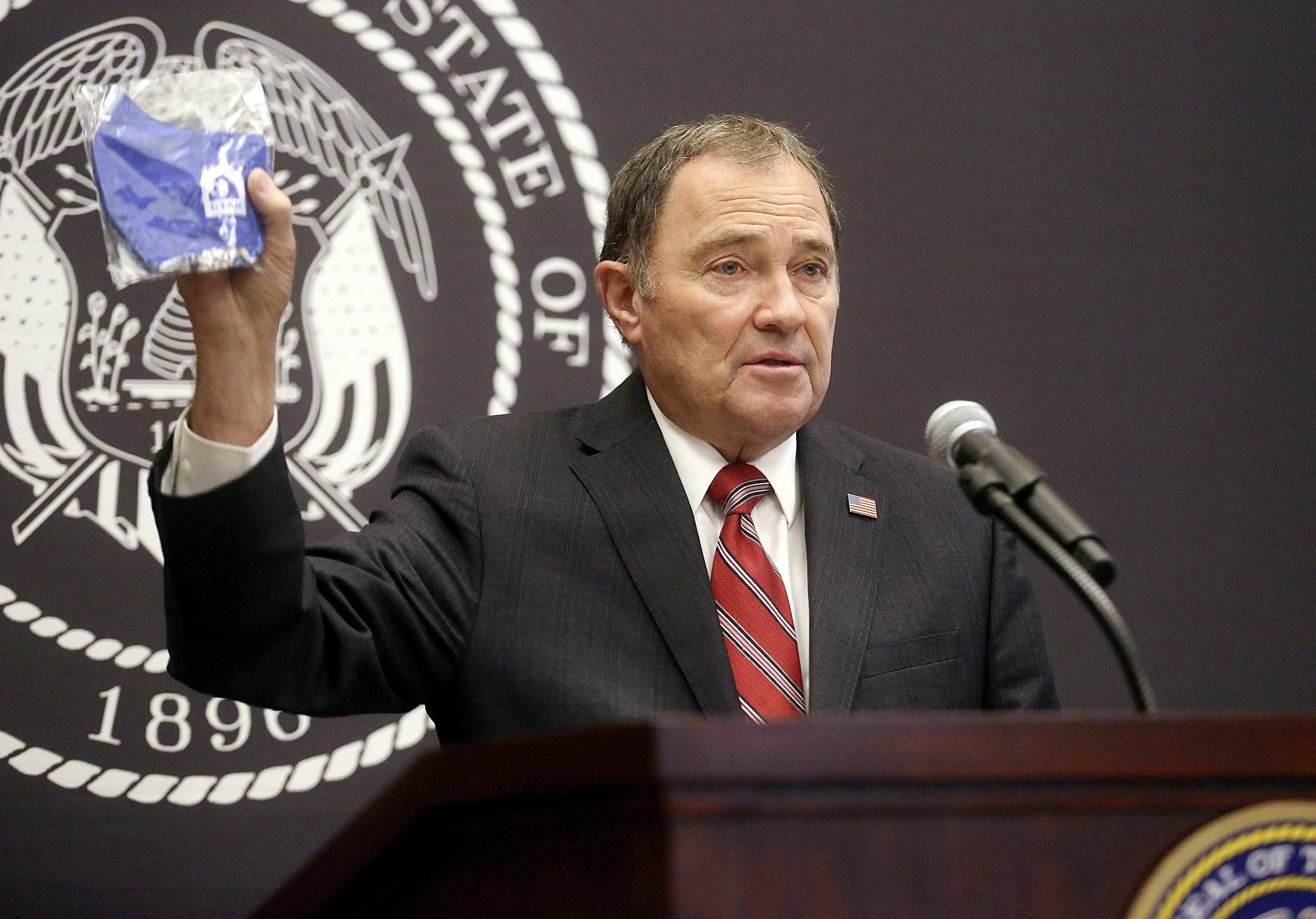 Gov. Gary Herbert holds a face mask during a COVID-19 briefing at the Capitol in Salt Lake City on Thursday, July 16, 2020. Herbert announces face coverings will be provided to K-12 students when they return to the classroom. (Photo: Kristin Murphy, KSL)