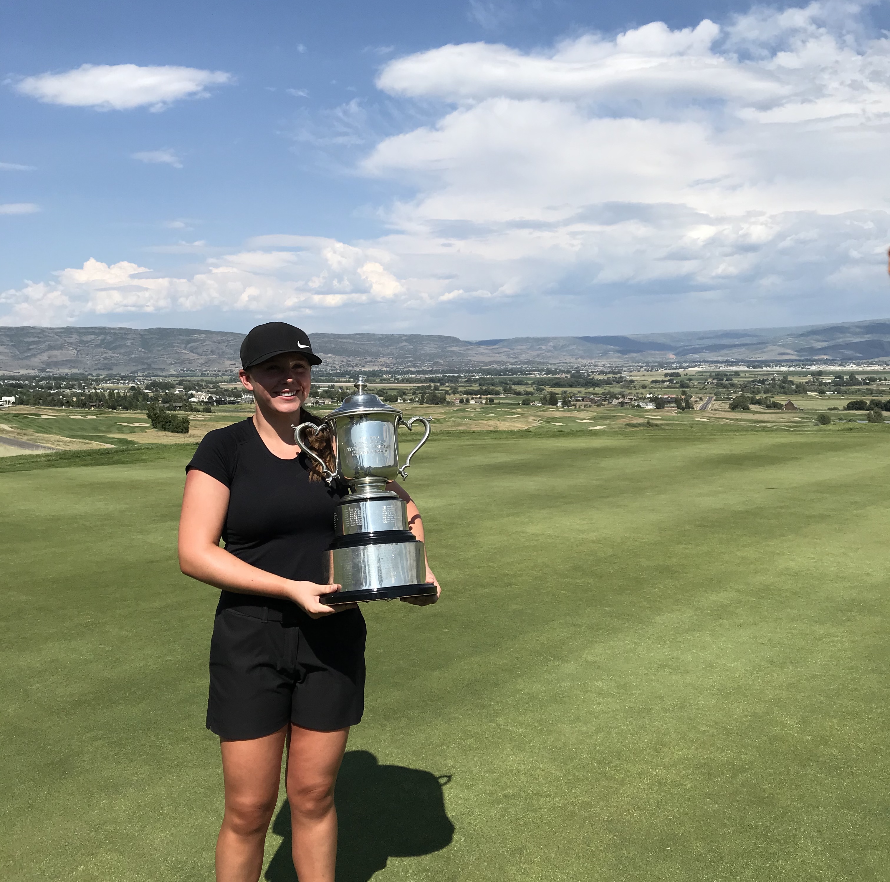 Grace Summerhays, 16, lifts up the trophy as the youngest-ever winner of the Utah State Women's Amateur on Thursday, July 16, 2020 at Soldier Hollow golf course in Midway.