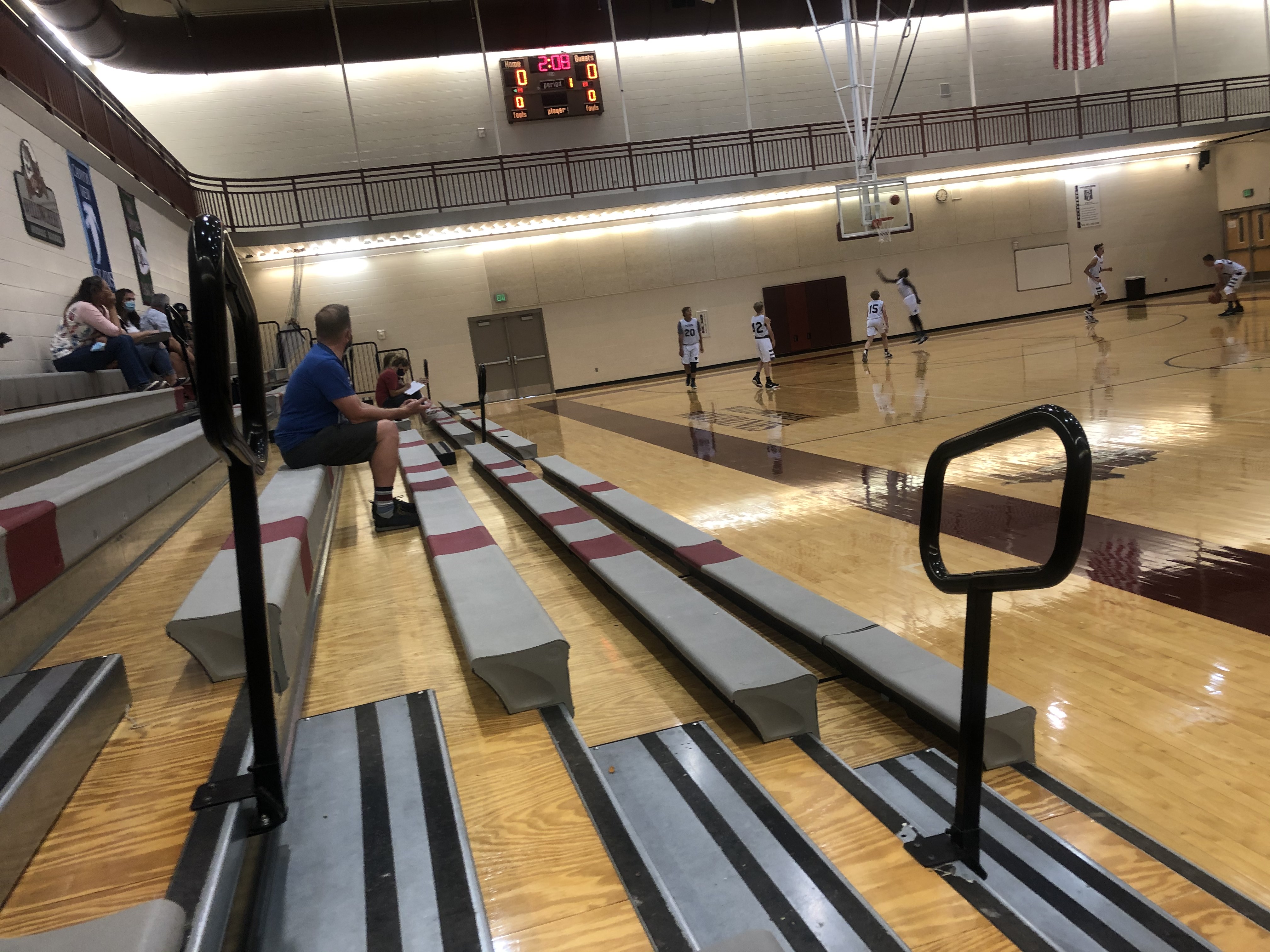 Spectators wear masks and social distance at a youth basketball game. (Photo: Arianne Brown)