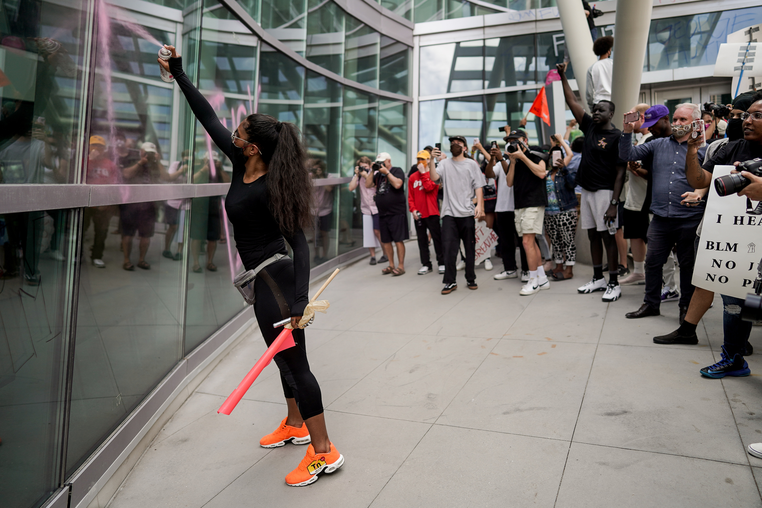 Man charged with vandalizing police station from roof during downtown riot