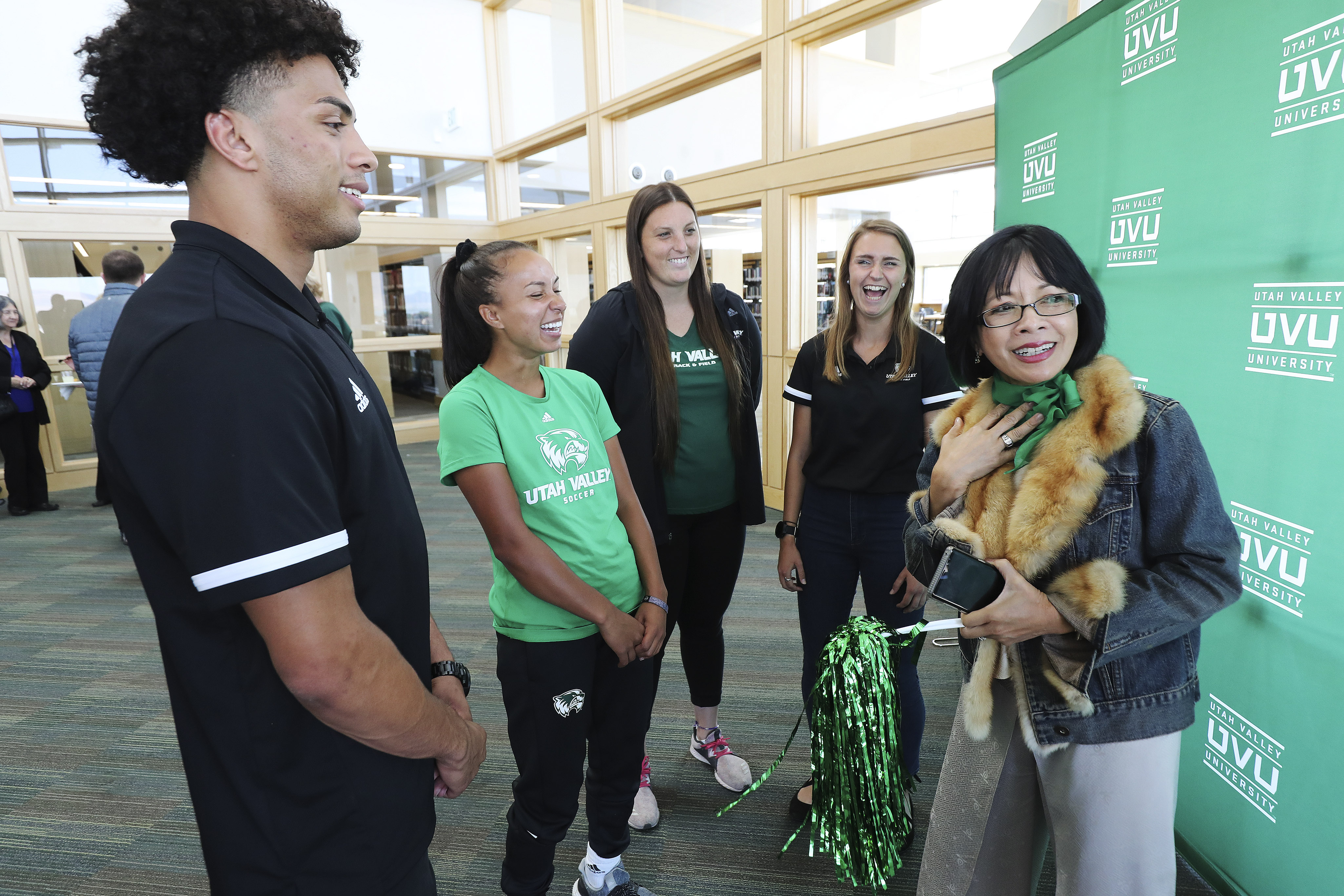 Utah Valley University President Astrid Tuminez, right, laughs with student athletes after doTerra announced on Friday, Sept. 27, 2019, it is donating $17.7 million to the Orem university over the next 10 years.