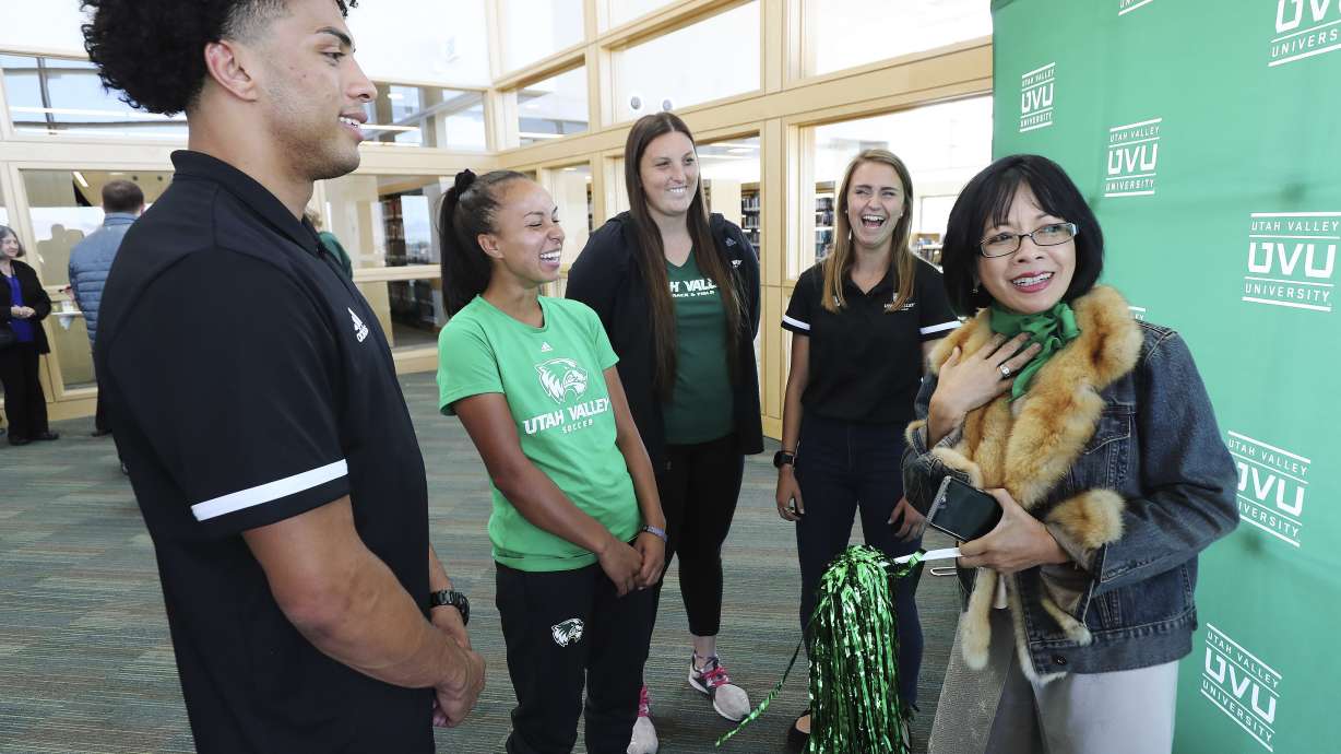 Utah Valley University President Astrid Tuminez, right, laughs with student athletes after doTerra announced on Friday, Sept. 27, 2019, it is donating $17.7 million to the Orem university over the next 10 years.
