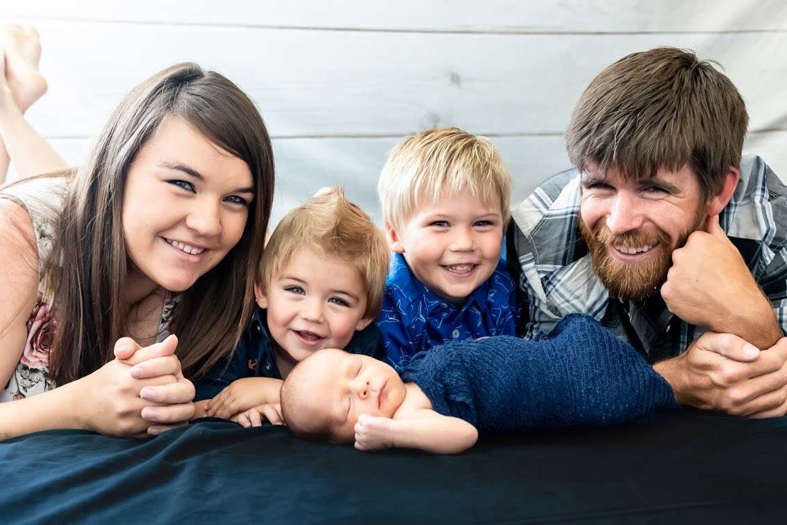 Parker and Mckenzii Palmer pose with their three children. (Family photo)