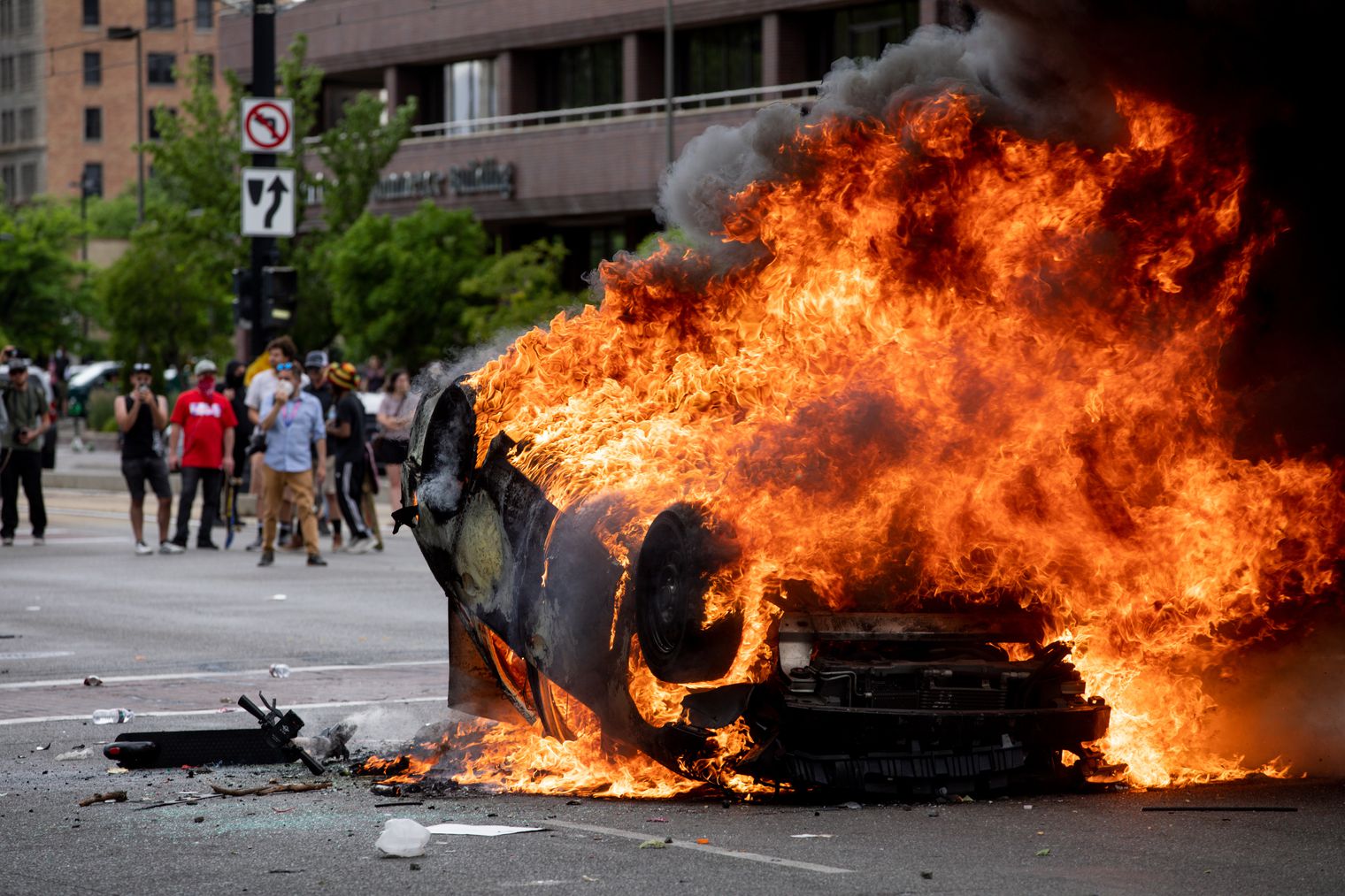 A police car is engulfed in flames as people protest police brutality in Salt Lake City on Saturday, May 30, 2020. (Photo: Ivy Ceballo, KSL, File)