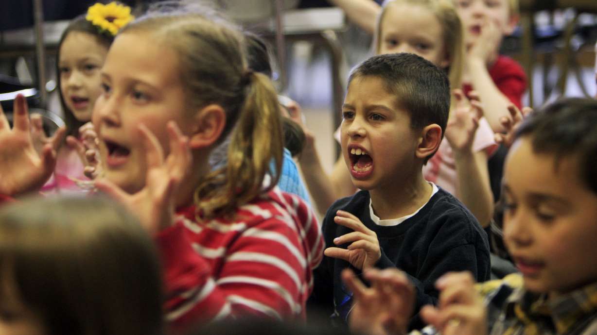 Camden Hurd, center right, makes different sounds as they learn to speak Chinese. Students at Calvin Smith Elementary participate Tuesday, March 6, 2012 in 1st and 3rd Grade Dual Immersion Chinese classes.