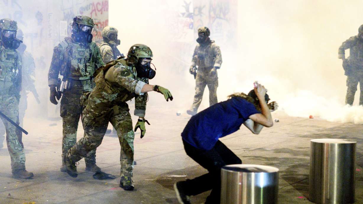 Portland's mayor tear-gassed by US agents as protest rages