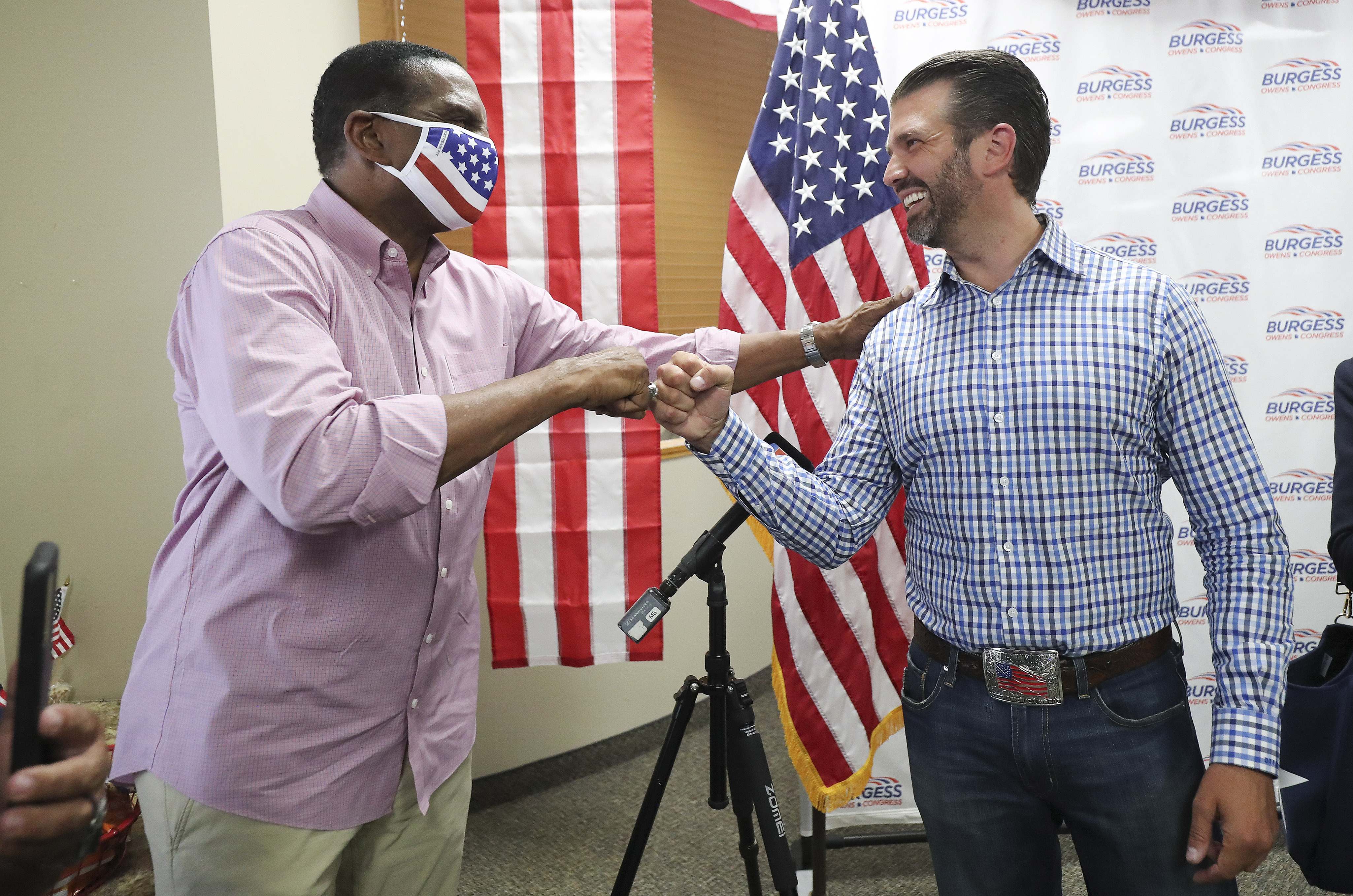 Donald Trump Jr., right,  meets with congressional candidate Burgess Owens and volunteers at Colonial Flag in Sandy on Thursday, July 23, 2020.