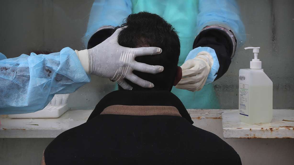 Asia Today: Amid new surge, India tests potential vaccine